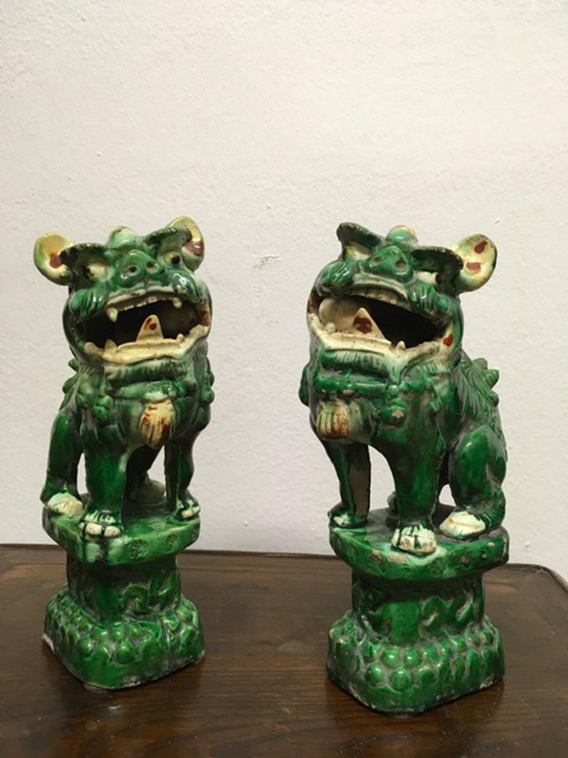 This pair of Qing Pho dogs is very decorative for its green colored enamel and very trendy in an elegant room.
According to Eastern thought the Pho Dogs are the protector of the house.
They were not restored and there is some signs of the time, but