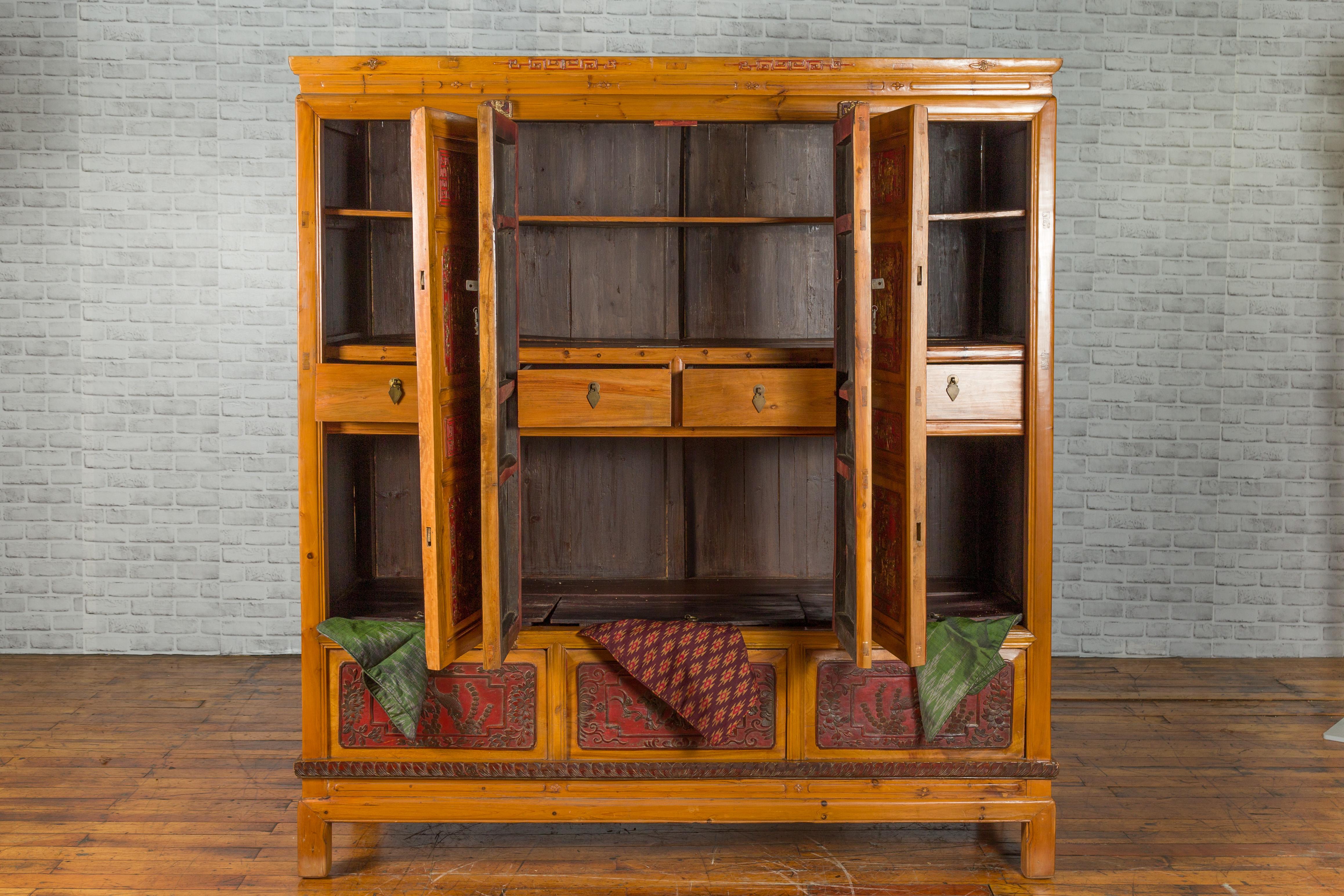 Hand-Carved Qing Dynasty 19th Century Chinese Hand Carved Armoire with Gilt Painted Panels