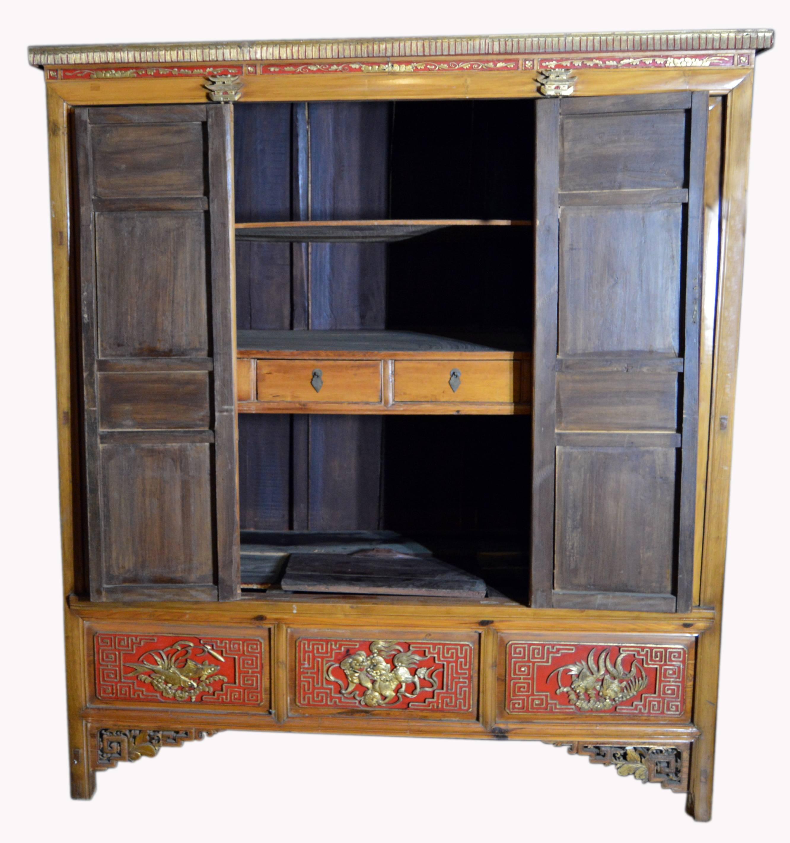Qing Dynasty 19th Century Chinese Wooden Armoire with Hand-Carved Gilt Panels 11