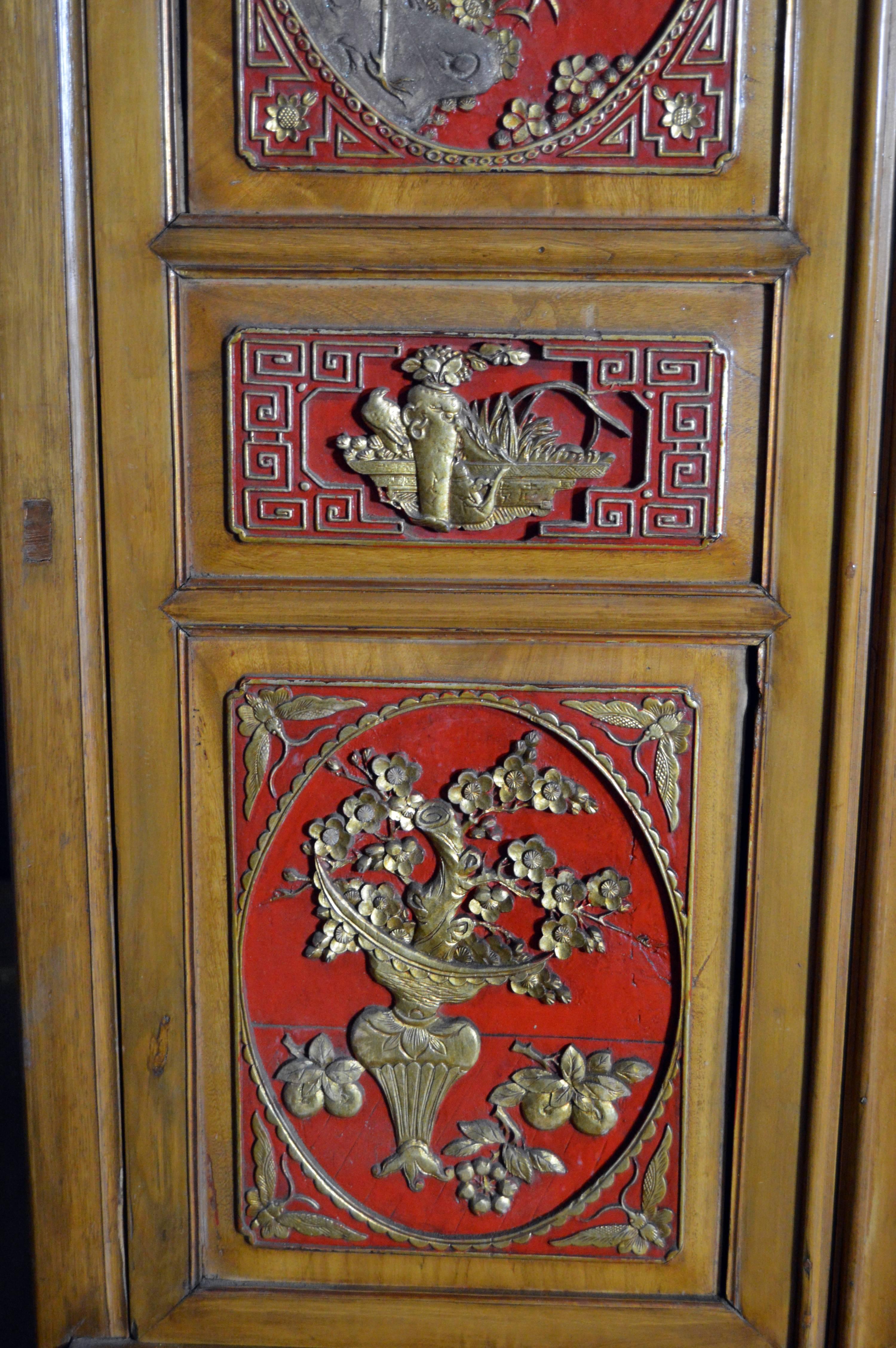 Qing Dynasty 19th Century Chinese Wooden Armoire with Hand-Carved Gilt Panels 4