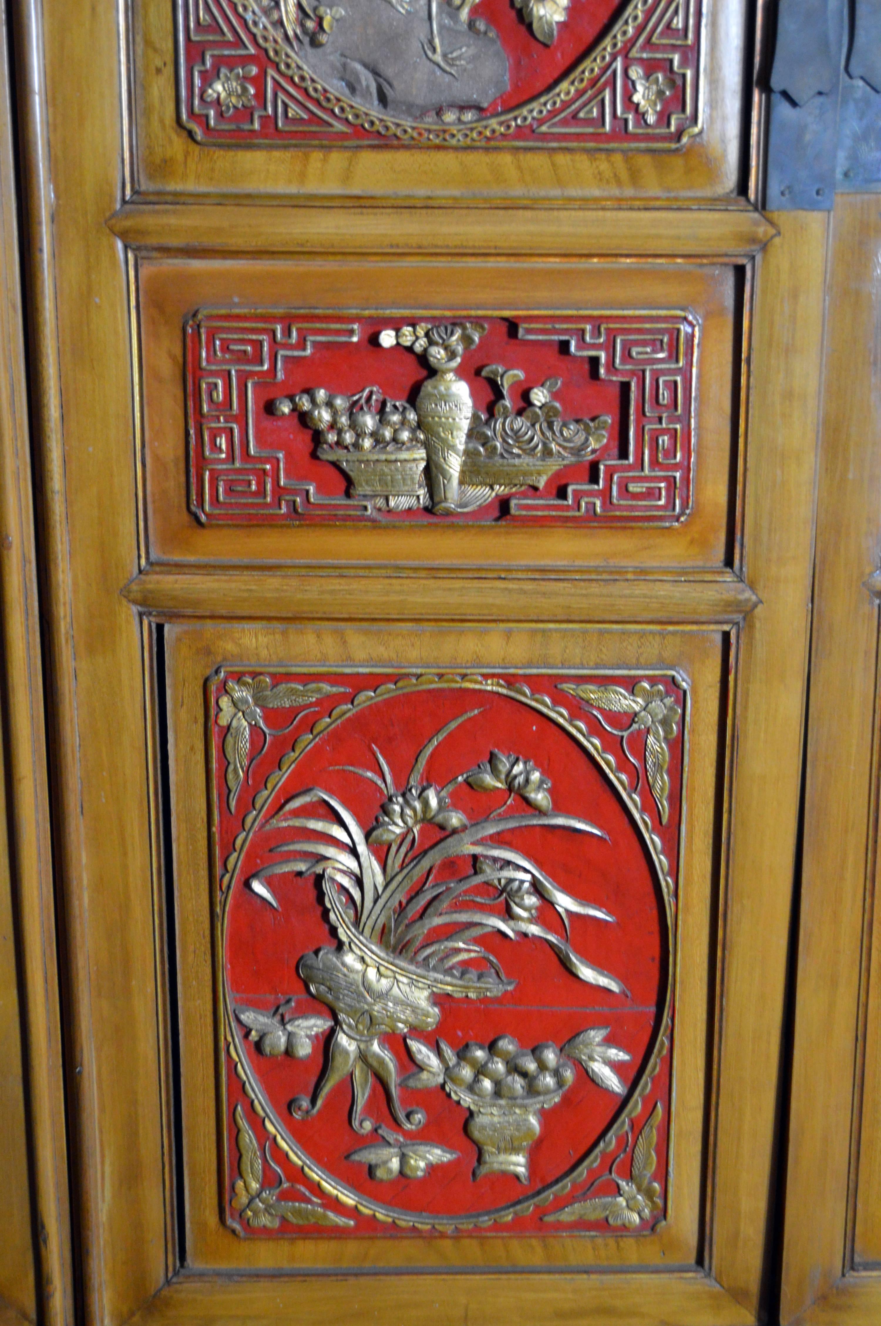 Qing Dynasty 19th Century Chinese Wooden Armoire with Hand-Carved Gilt Panels 5