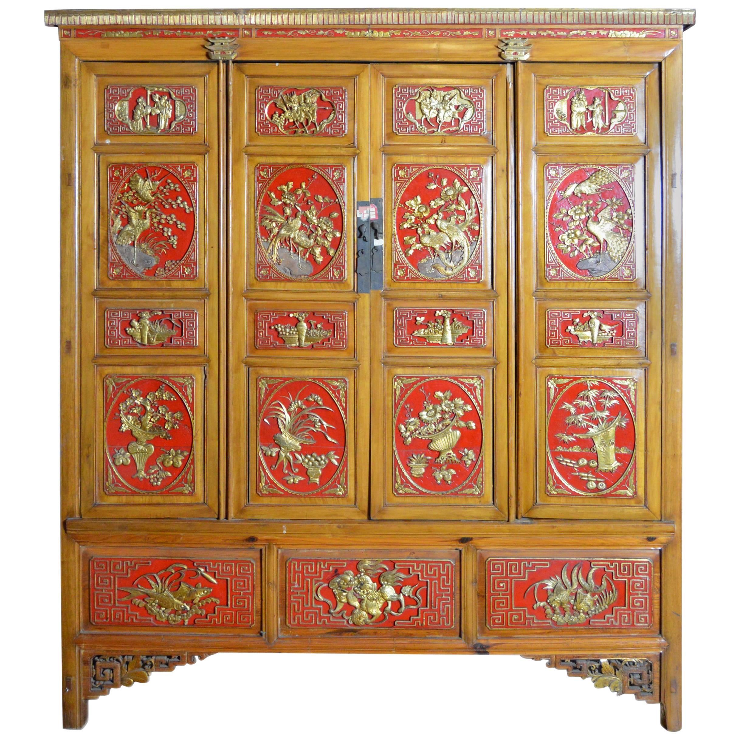 Qing Dynasty 19th Century Chinese Wooden Armoire with Hand-Carved Gilt Panels