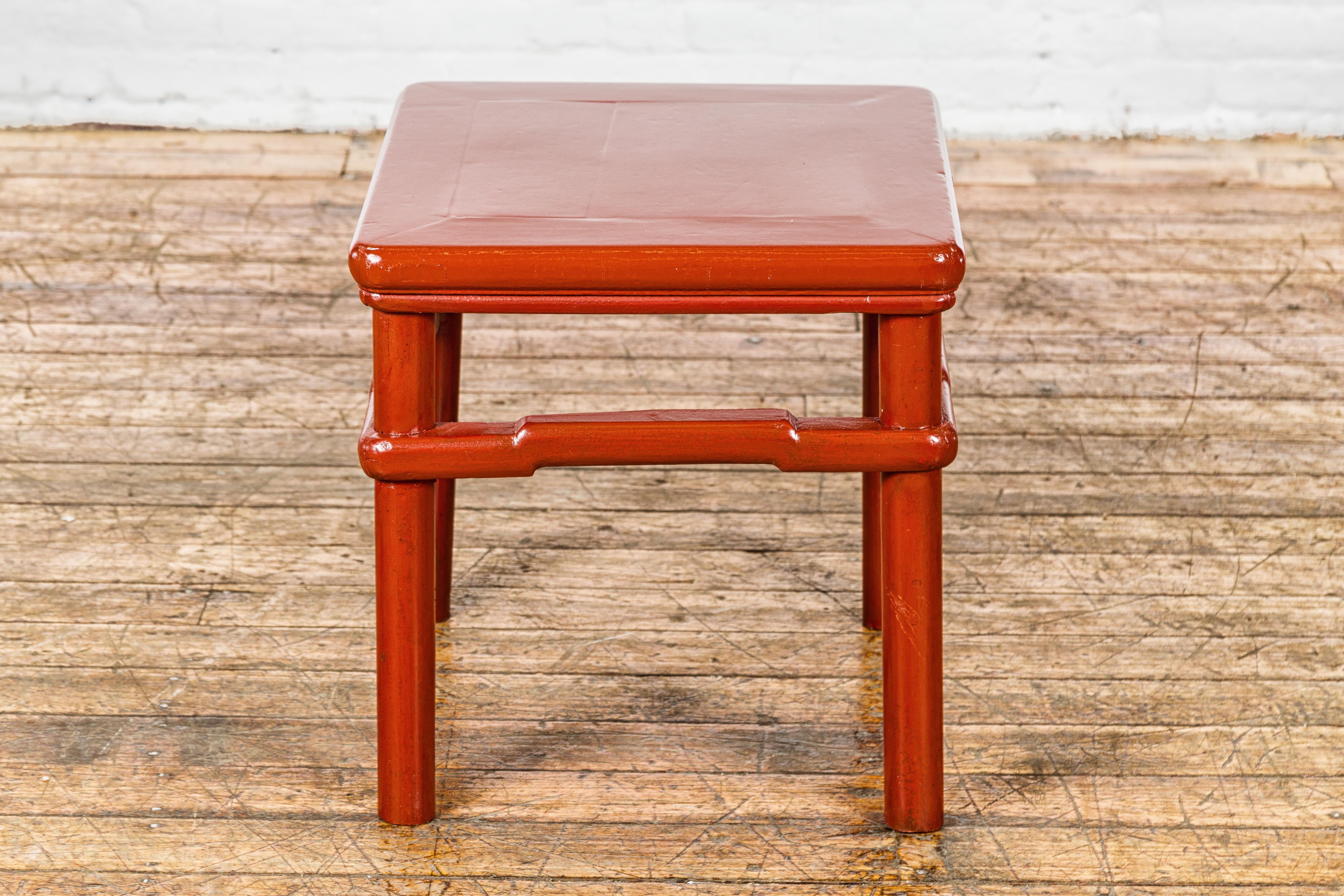 Lacquered Qing Dynasty 19th Century Red Lacquer Side Table with Humpback Stretcher For Sale