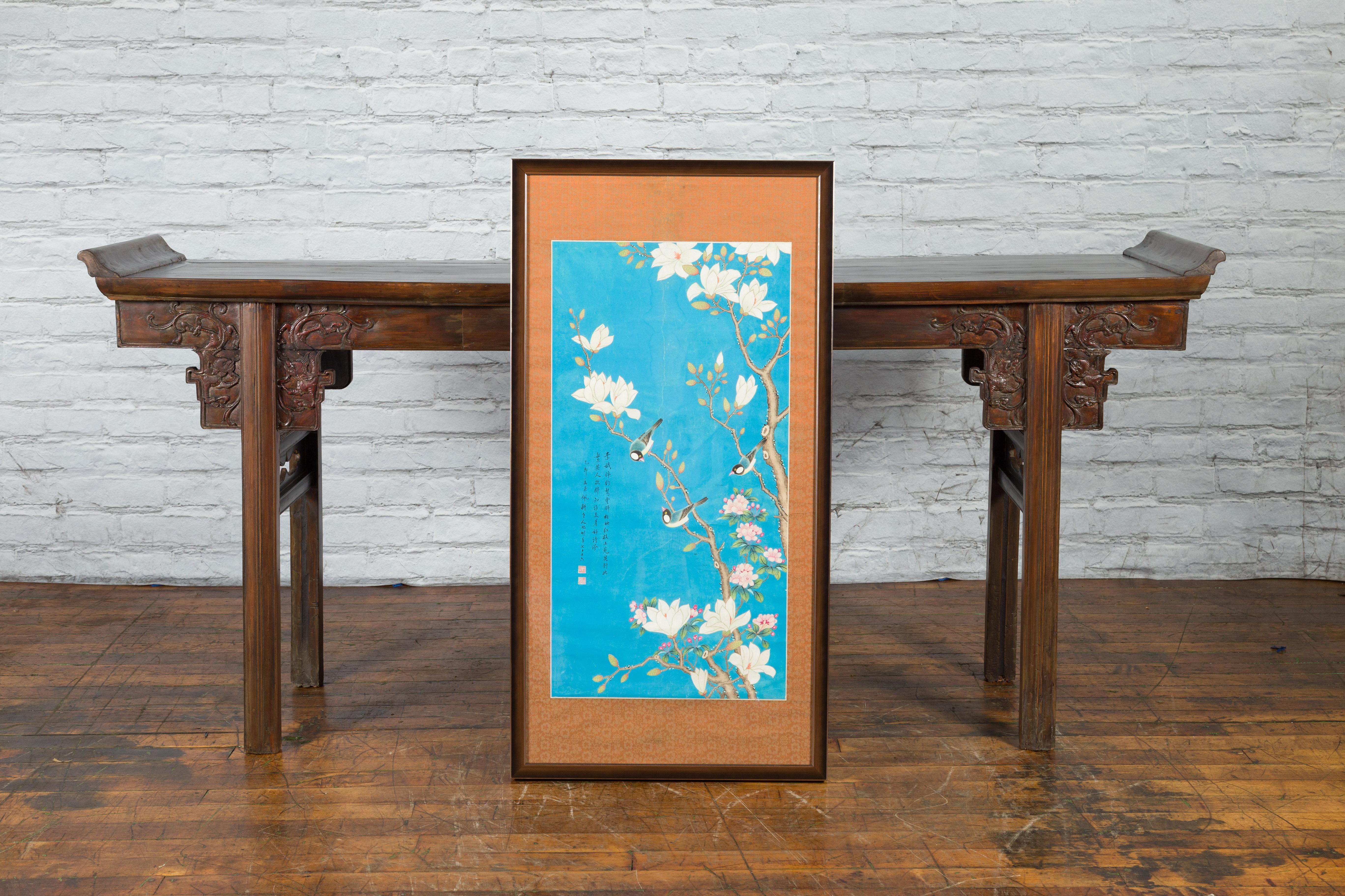 A Chinese Qing Dynasty period print from the 19th century, depicting birds in a tree on turquoise ground, with custom frame. Created in China during the Qing Dynasty period, this large print attracts all the attention with its striking turquoise