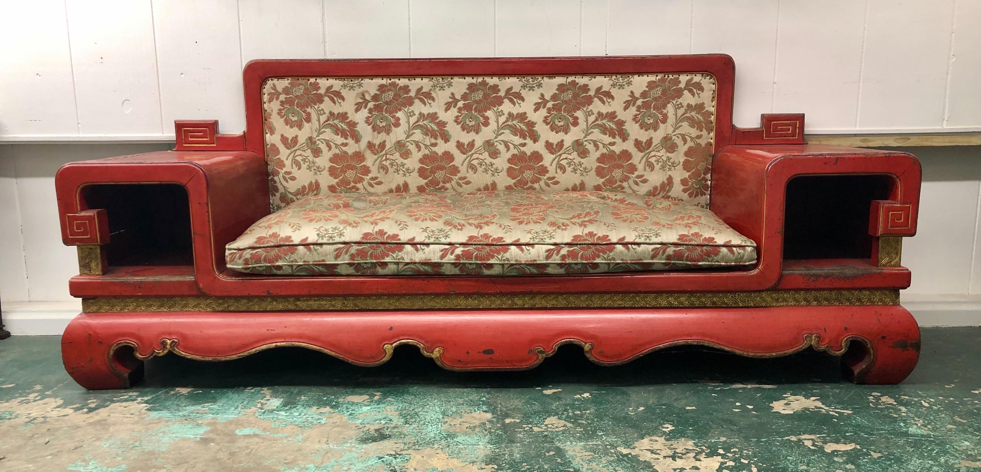 This Imperial red Lacquer Chinese bench with gilt highlights was made in the late Nineteenth Century during the late Qing Dynasty. The Aesthetic Movement Chinese sofa is handmade using intricate Chinese joinery. The Chinese Bench comes in two parts