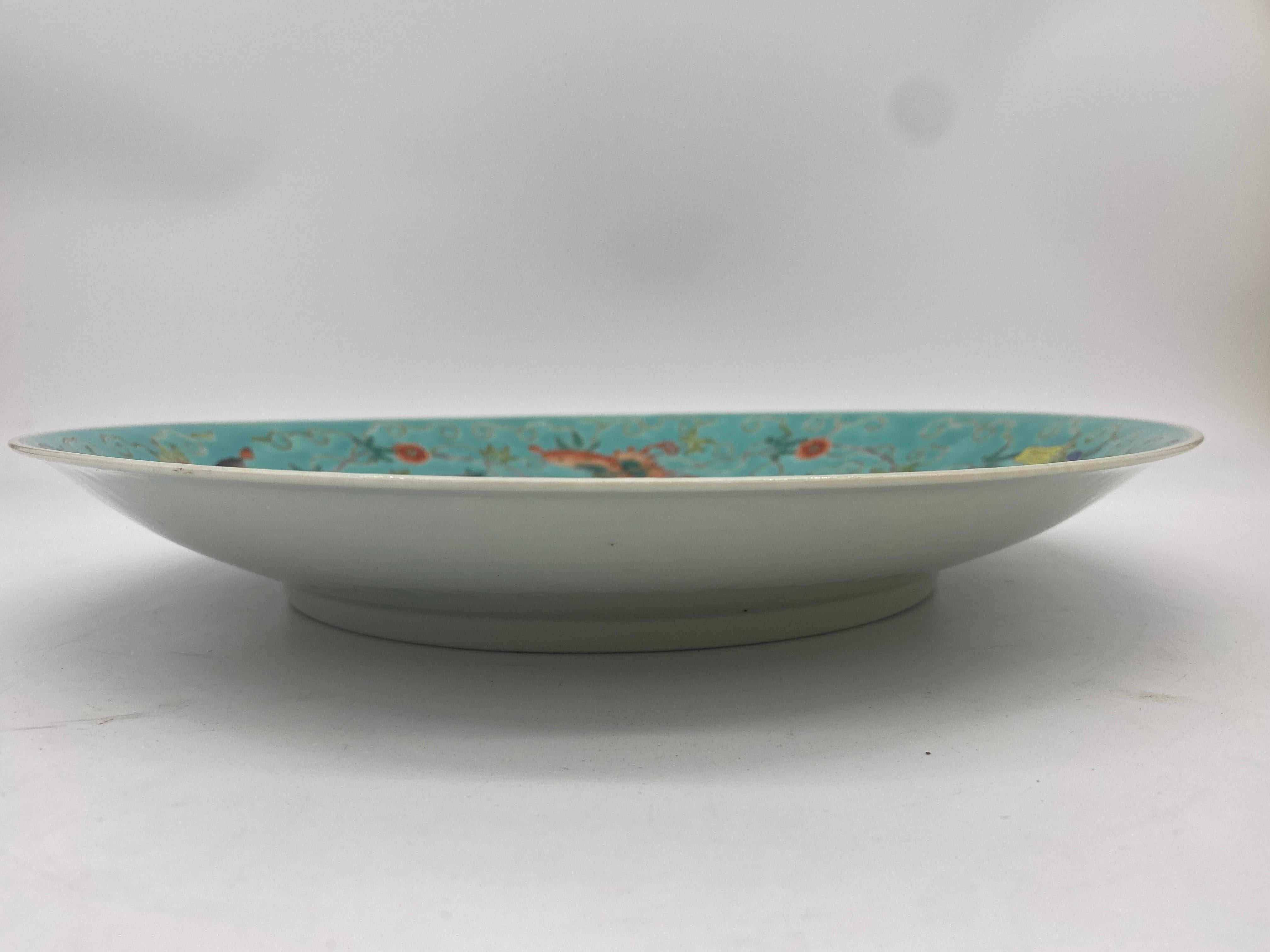 Qing Dynasty an antique 19th century Chinese porcelain plate decorated with five butterfly and flowers, with daqing guangxu nianzhi mark, the . Measures: 13'' diameter x 1.75'' high.