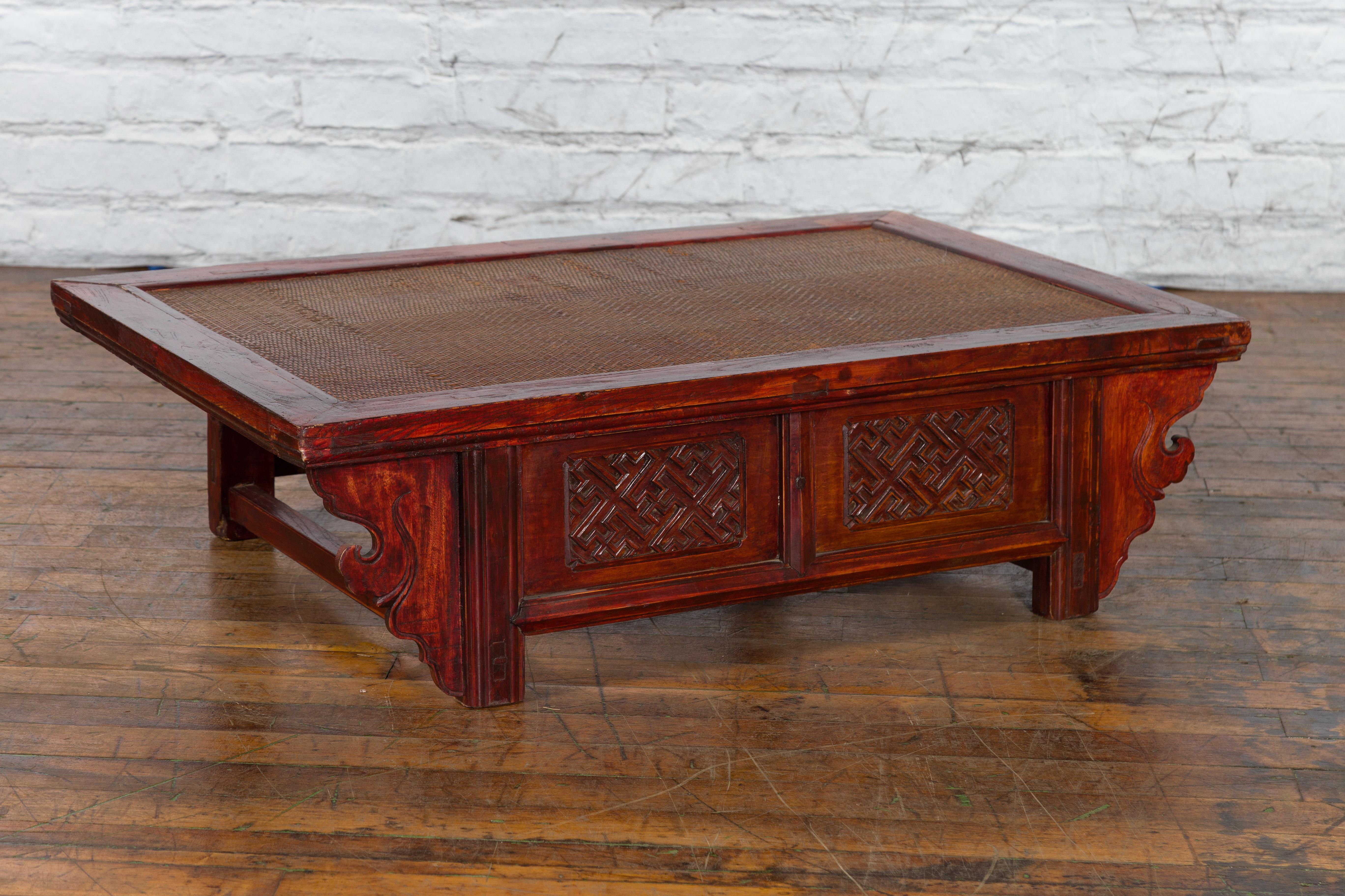 Carved Qing Dynasty Chinese 19th Century Dark Red Lacquer Coffee Table with Rattan Top For Sale
