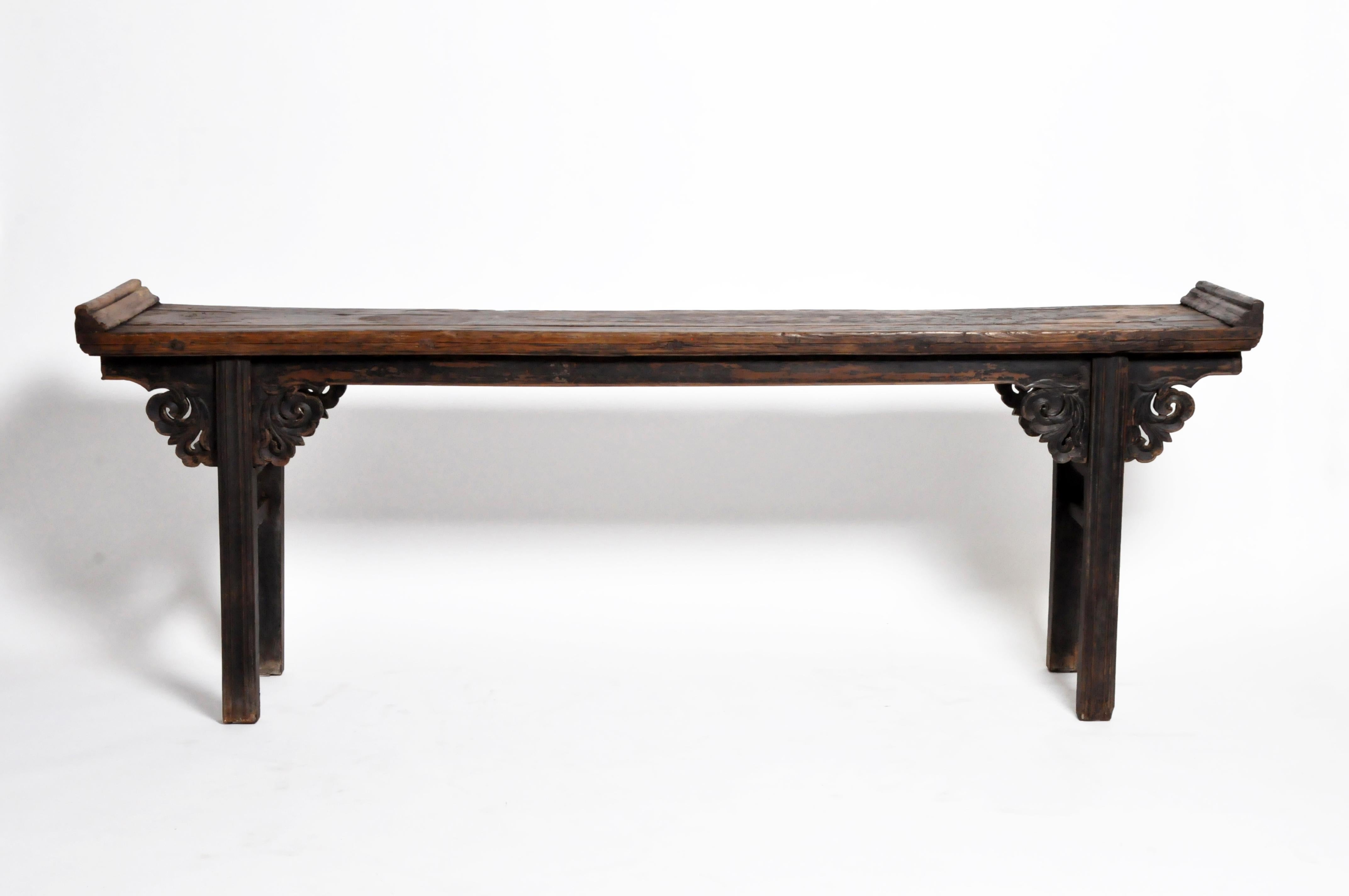 This long and graceful Chinese altar table features a rich oxblood patina that has darkened greatly with age. Oxblood is one of the three traditional Chinese lacquers. Red and black lacquers are fully opaque. Oxblood lacquer, however, is translucent