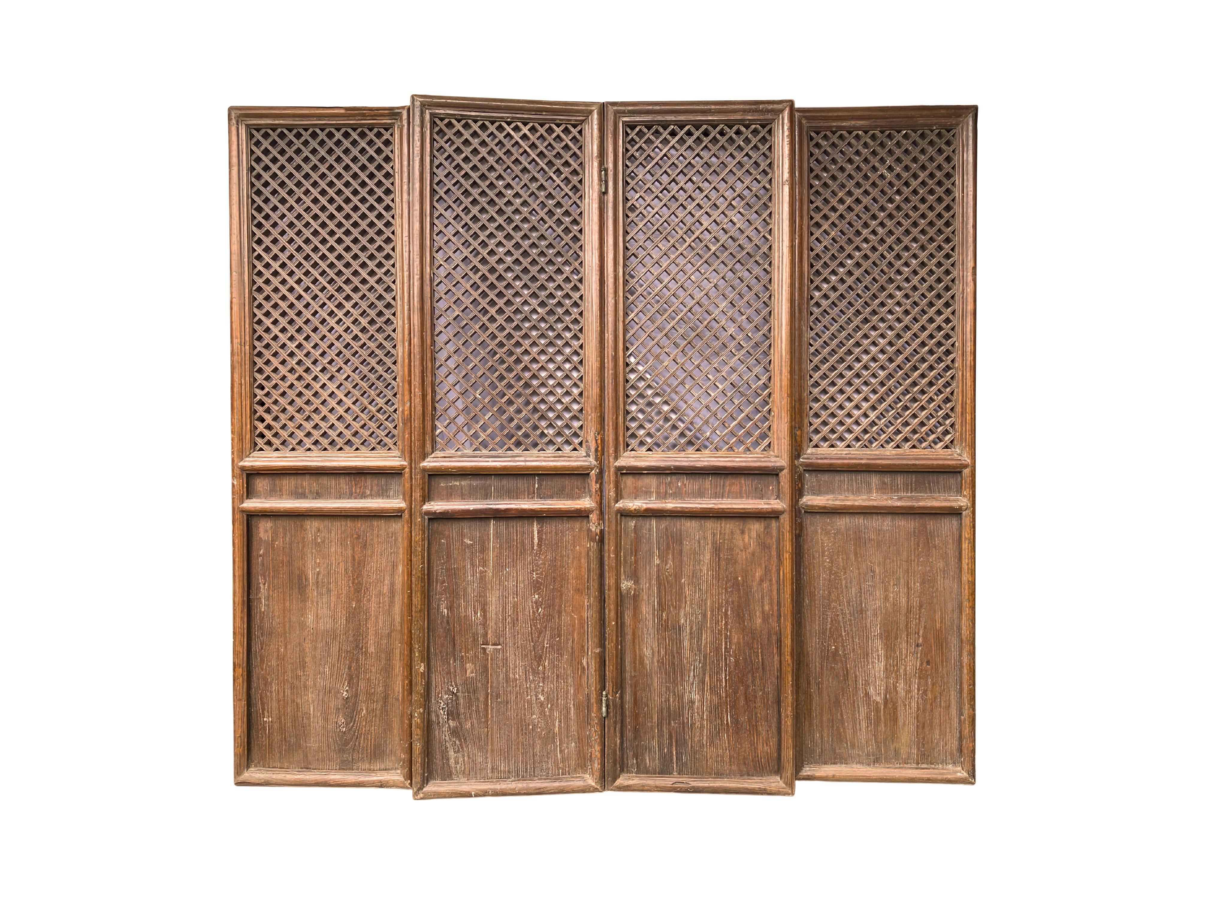 A testement to Qing Dynasty craftsmanship this folding panel features wonderful lattice windows. The panel still features its original hinges that allows for many ways to position this piece. Panels such as these would be used to divide interior