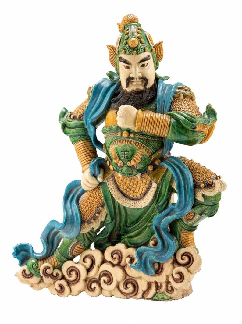 A large antique Chinese glazed Sancai pottery temple guardian figure, designed to ward off evil spirits and protect the owners tumb. Hand crafted, exceptional quality, deep rich polychrome color, the finely detailed antique sculpture featured posed