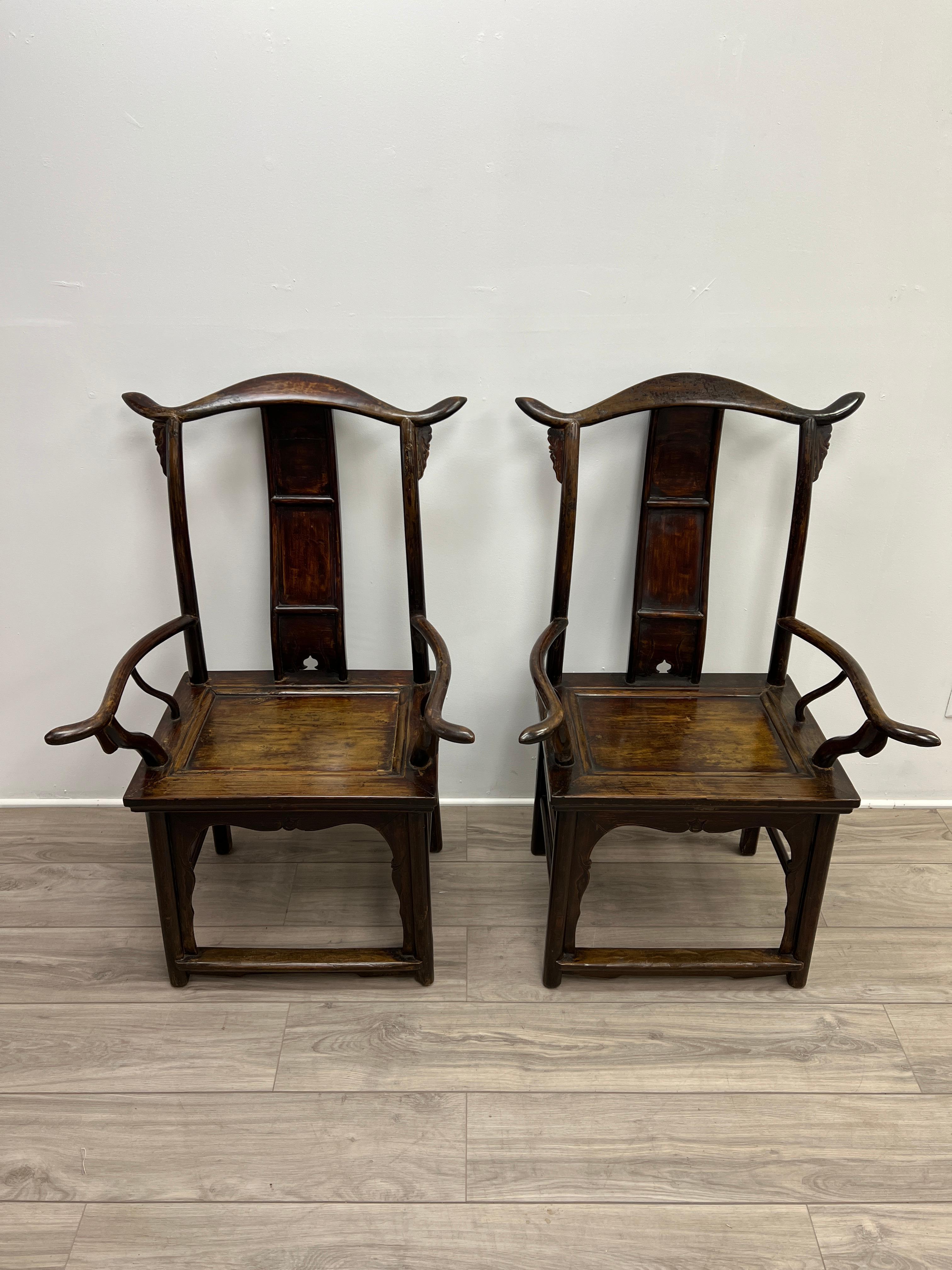 This is a very handsome and sumptous pair of Qing dynasty (1644-1912) Yoke back officials hat chairs. The pair is constructed of Chinese pear, Huanghuali ('yellow flowering pear'), or huali is from the rosewood family. The colours range from a