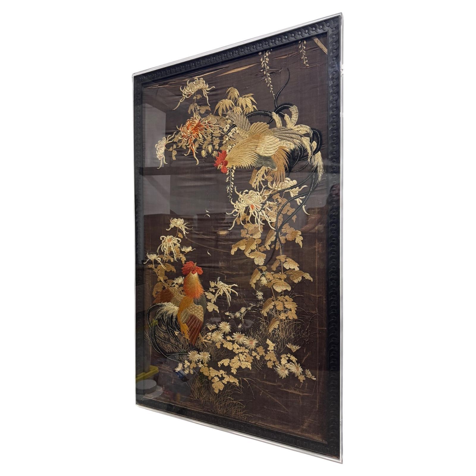 This amazing and rare Qing Dynasty silk tapestry is one of two available. it is exceptional in its antique handwoven embroidery work and depicts a stunning set of two roosters surrounded by a field of flowers and leaves.  the embroidery is in some