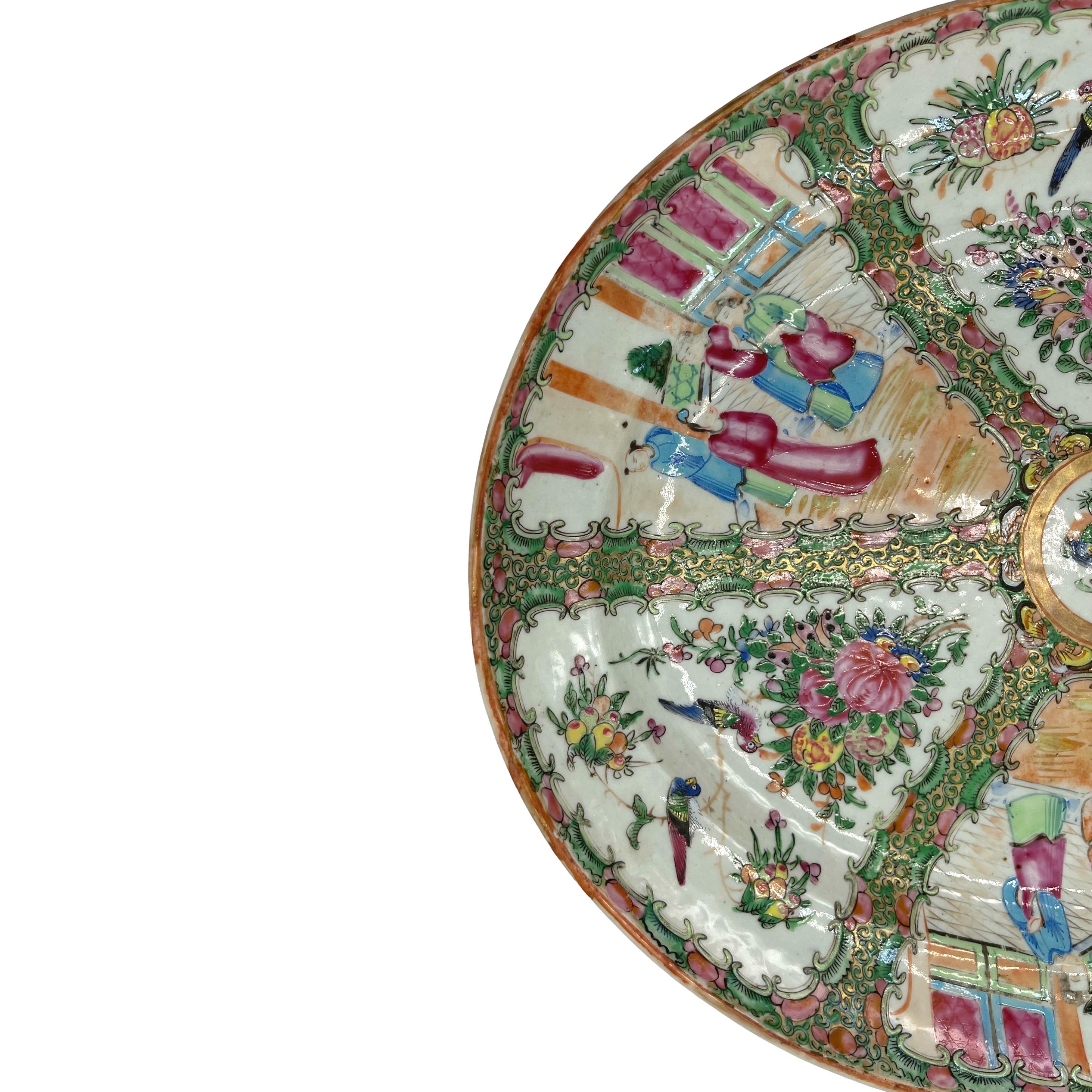 Qing Dynasty Famille Rose Medallion Platter, Canton c. 1880, polychrome enameled glazes on a hard-paste porcelain body, the center medallion with a single multi-colored bird among peonies within a gilded ring surrounded by a band of six butterflies,