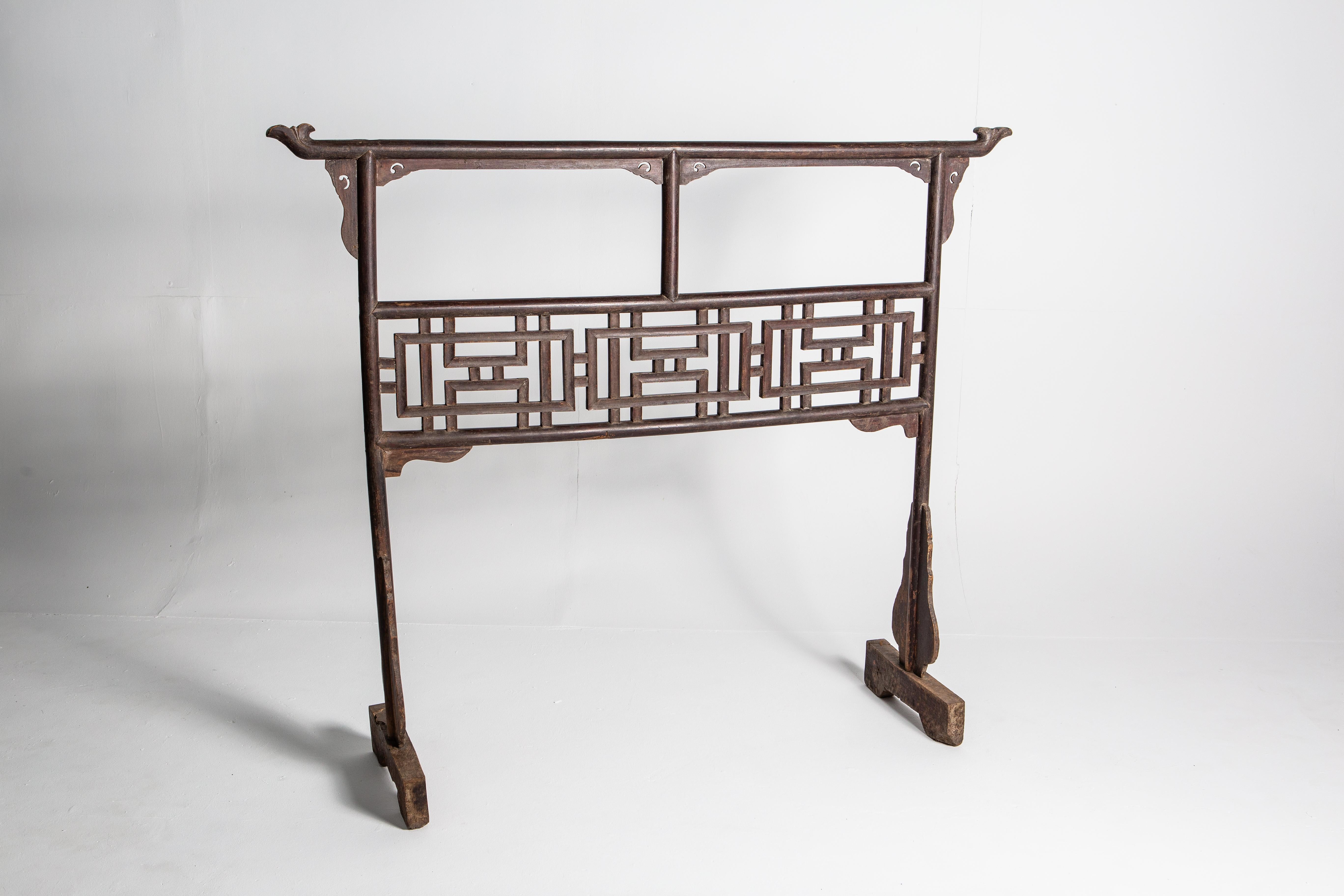 An interesting wooden garment rack of generous proportions. Ancient stand-up hangers like these were one of the most prevalent household accessories because Chinese architectural traditions didn’t provide for closet space. Here, the eye travels from