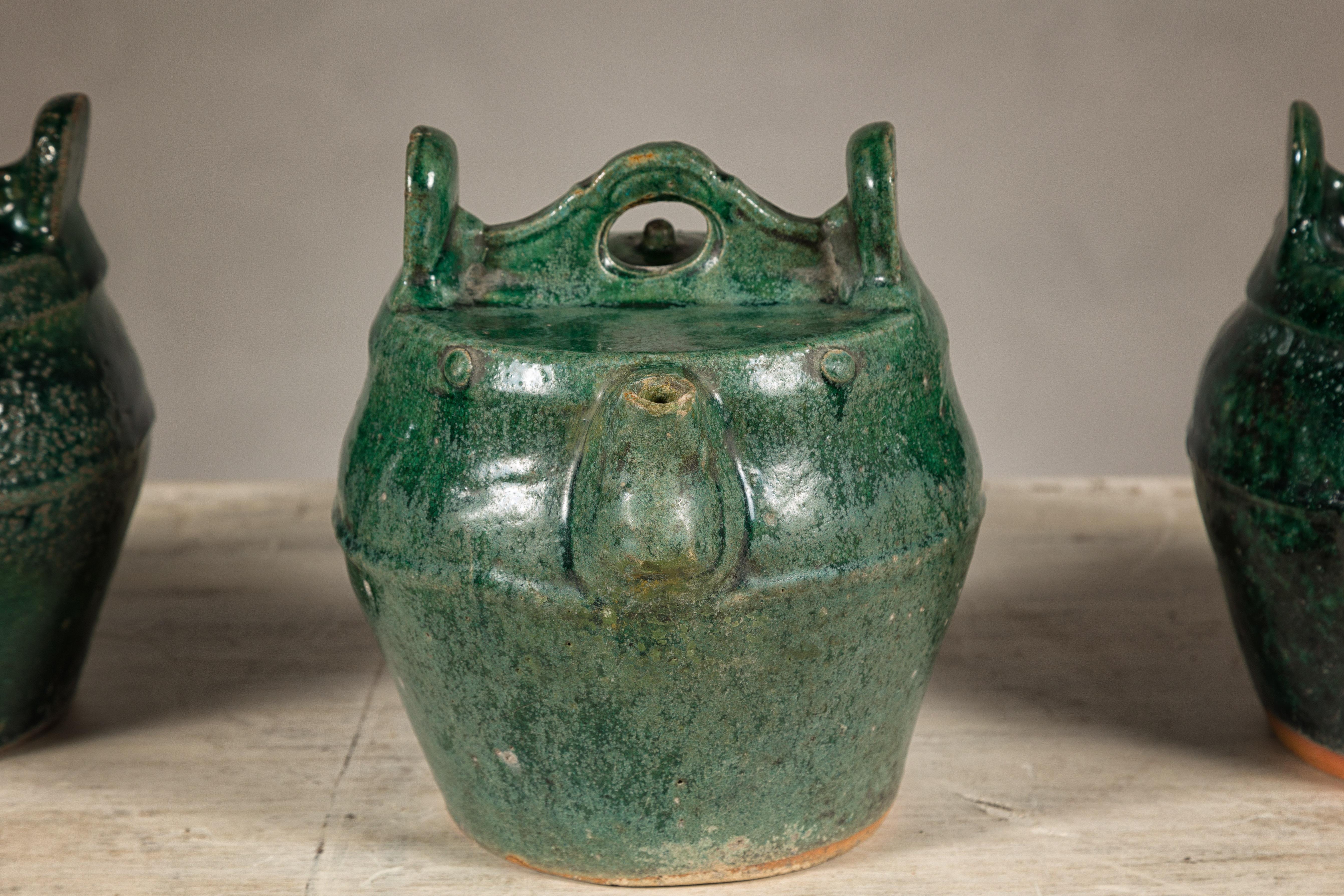 Qing Dynasty Green Glaze Late 19th Century Shiwan Ware Pottery Teapots Sold Each In Good Condition For Sale In Yonkers, NY