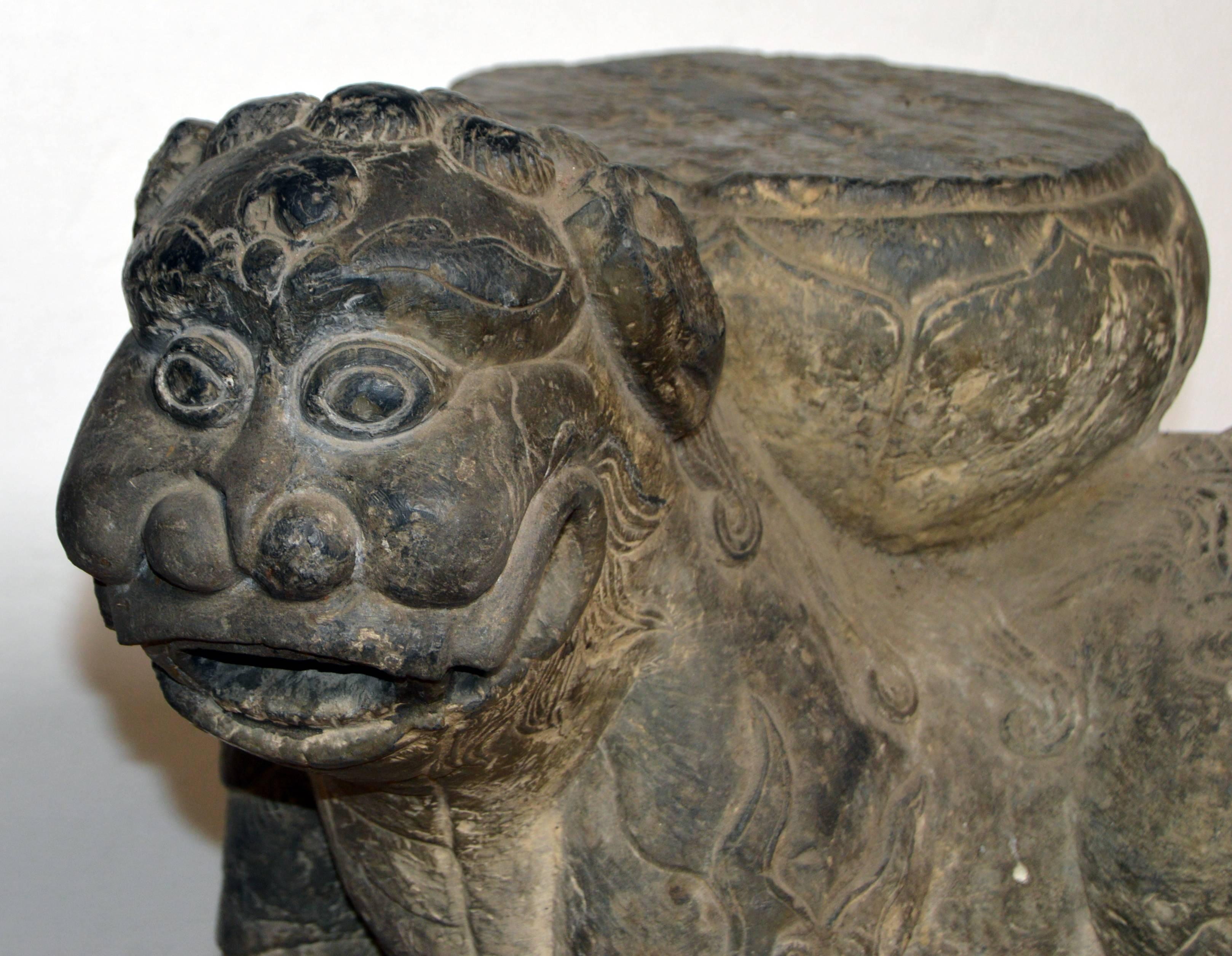 A 19th century Chinese Qing dynasty (1644-1911) hand-carved stone foo dog sculpture playing with a cub. The name foo dog is actually a mistake made in the west. In reality these imperial Chinese guardians are lions, which were believed to have