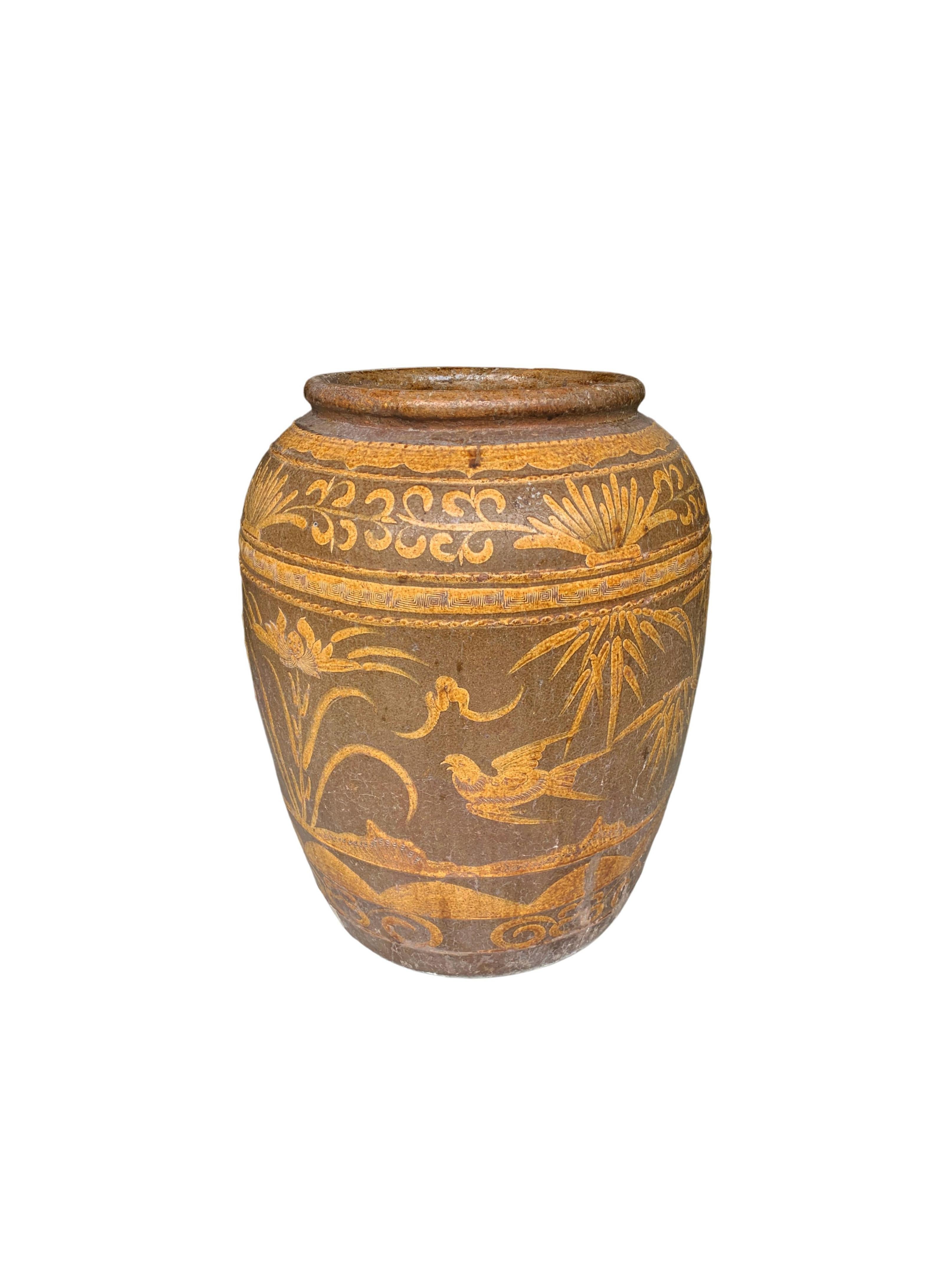 This Pickling Jar was once used to pickle eggs and features a wonderful array of hand-painted motifs which include birds, foliage and other subtle symbols and patterning. The hand-painted detailing is raised and rich in texture as the painting was
