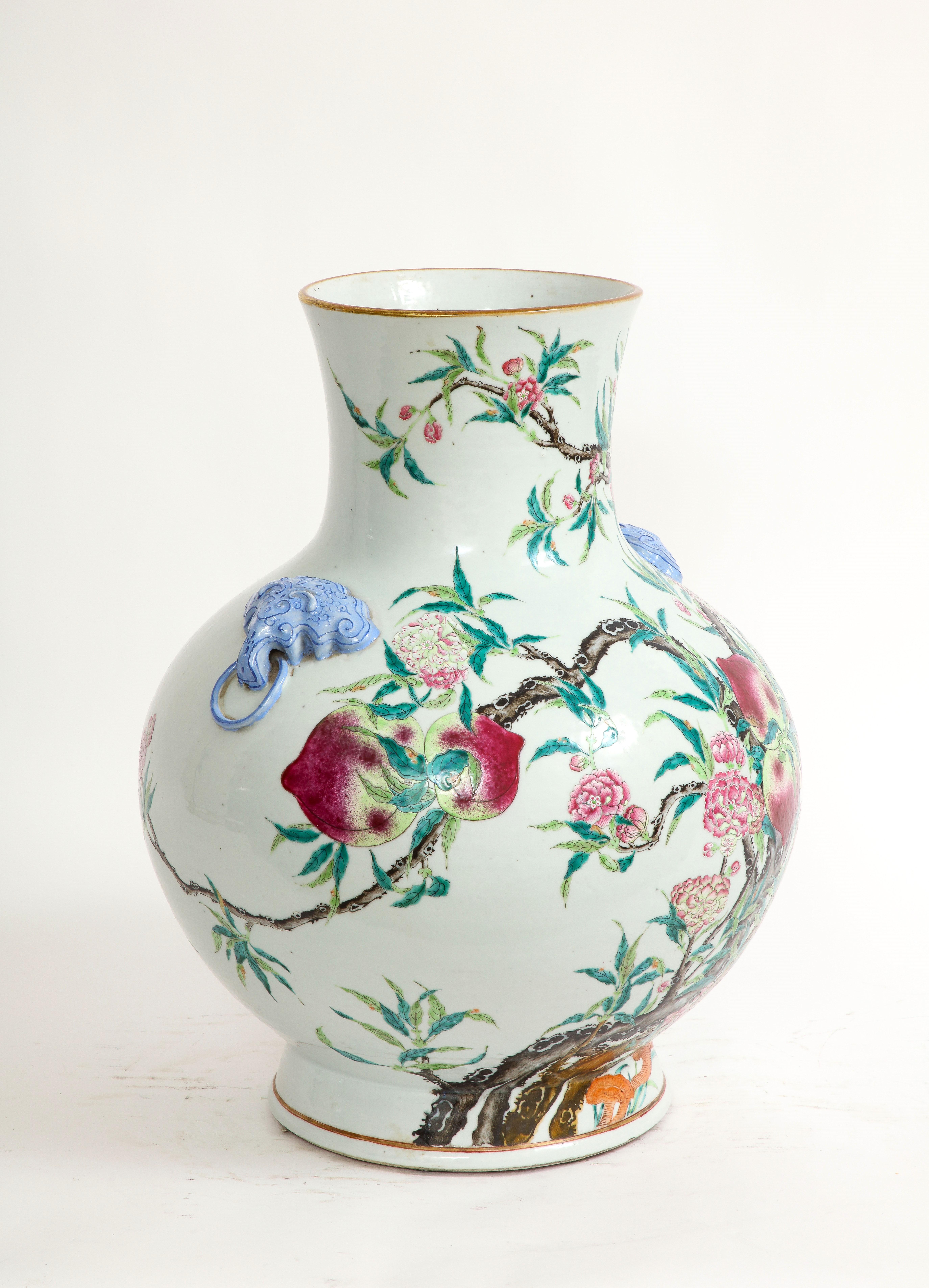 Qing Dynasty Large Chinese Blue Foo Dog Handled Famille-Rose Nine Peach Vase In Good Condition In New York, NY