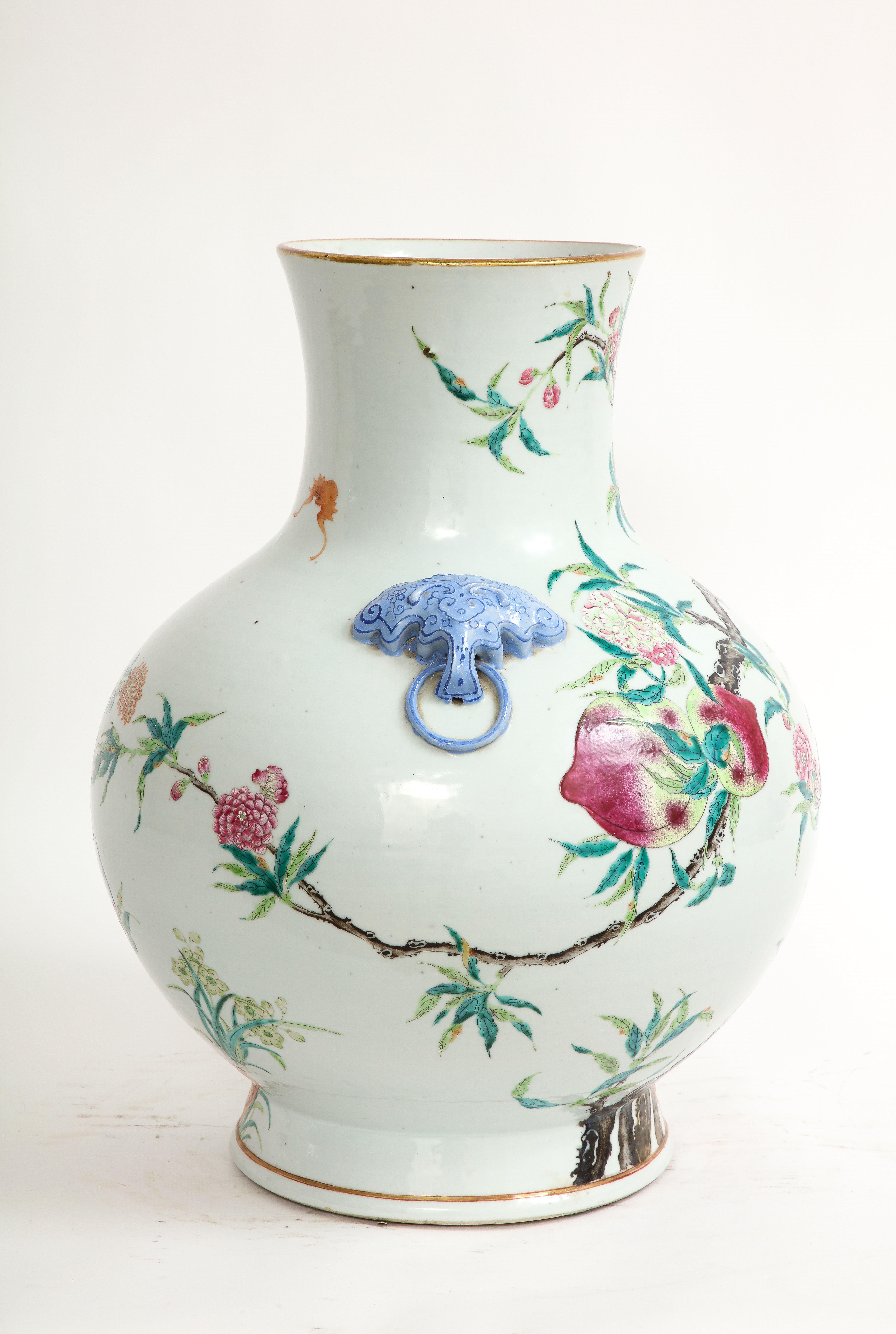 Mid-19th Century Qing Dynasty Large Chinese Blue Foo Dog Handled Famille-Rose Nine Peach Vase