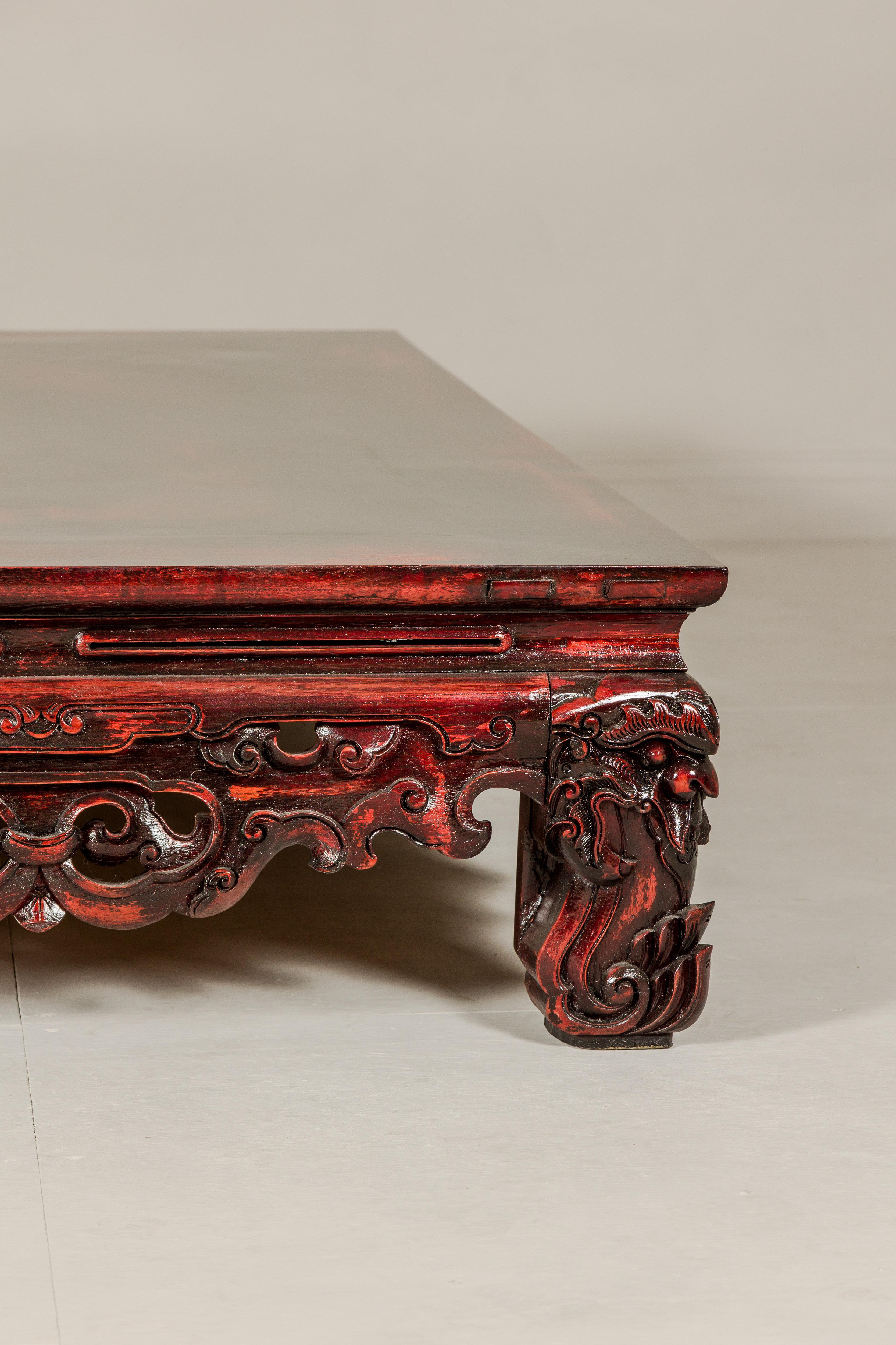 Qing Dynasty Low Kang Coffee Table with Reddish Brown Finish and Carved Décor For Sale 4