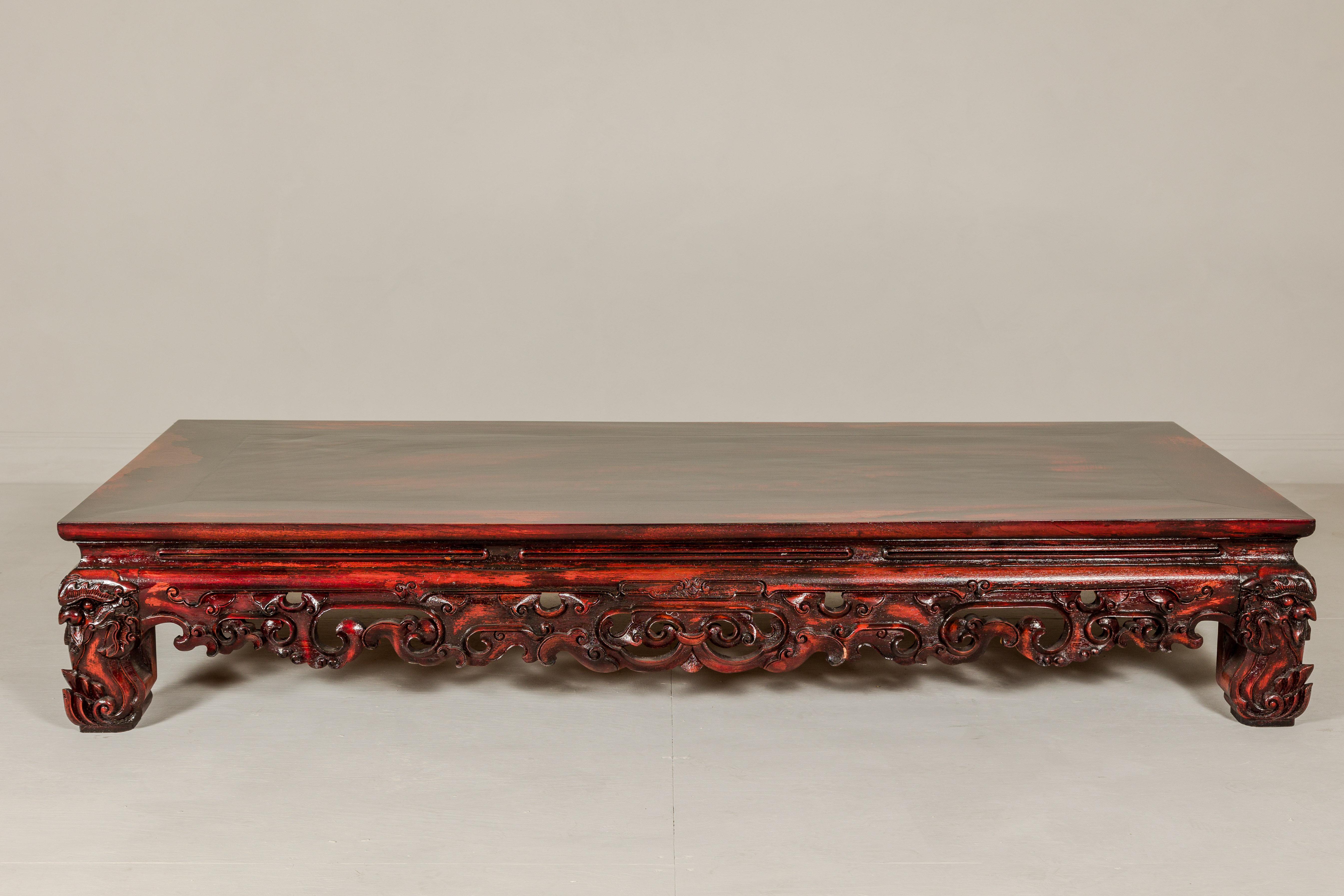 Qing Dynasty Low Kang Coffee Table with Reddish Brown Finish and Carved Décor For Sale 8