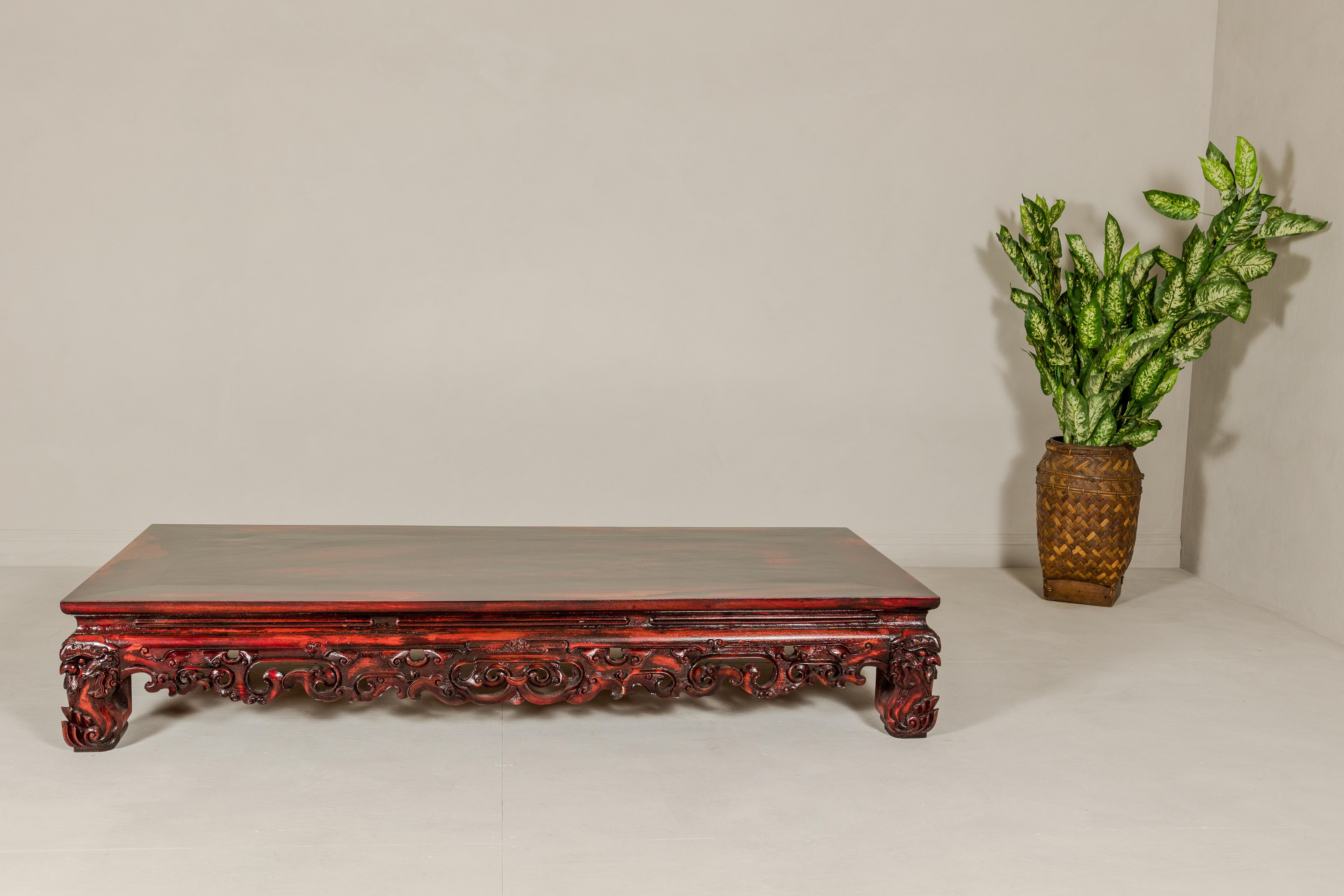 Qing Dynasty Low Kang Coffee Table with Reddish Brown Finish and Carved Décor For Sale 9