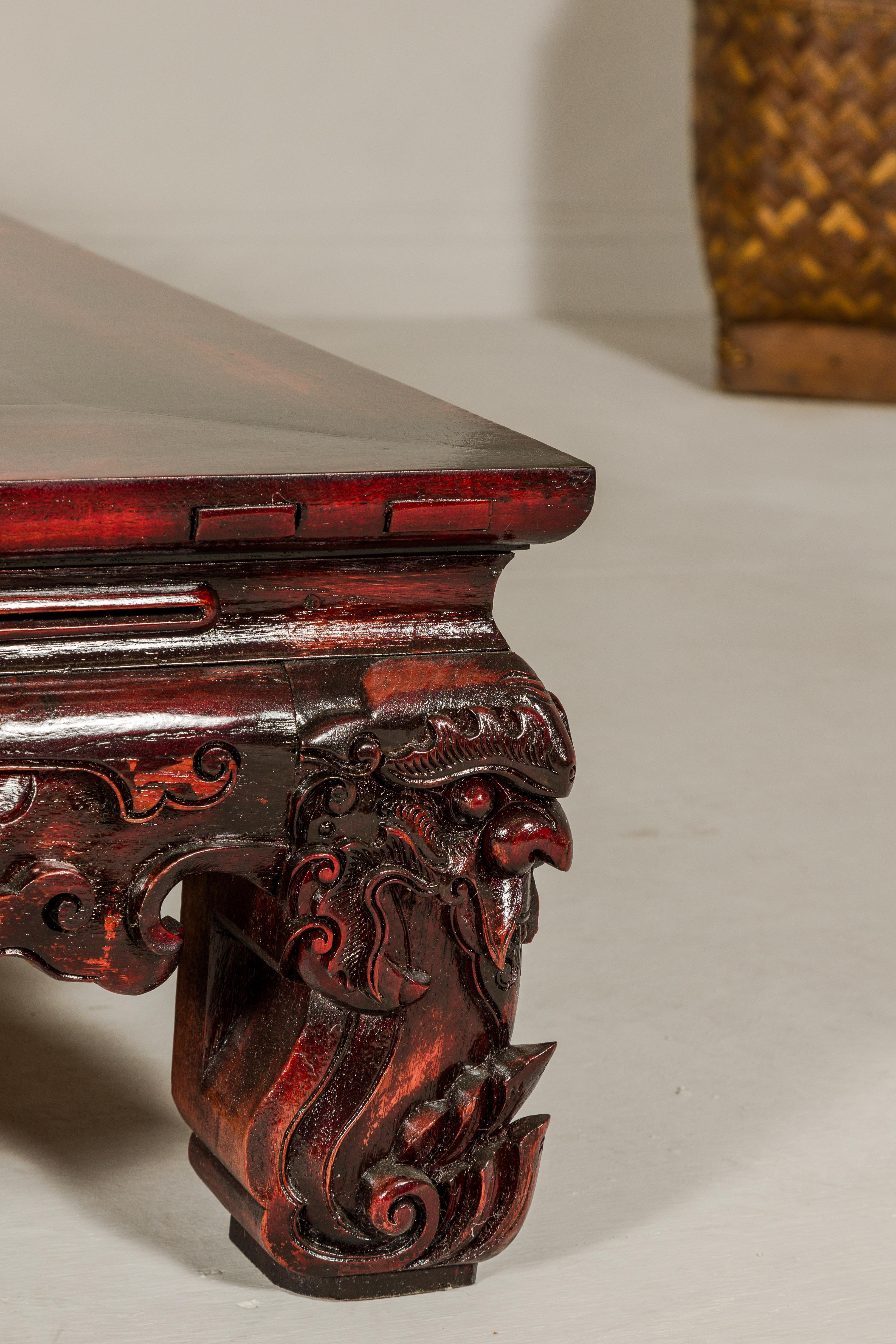 Qing Dynasty Low Kang Coffee Table with Reddish Brown Finish and Carved Décor For Sale 13
