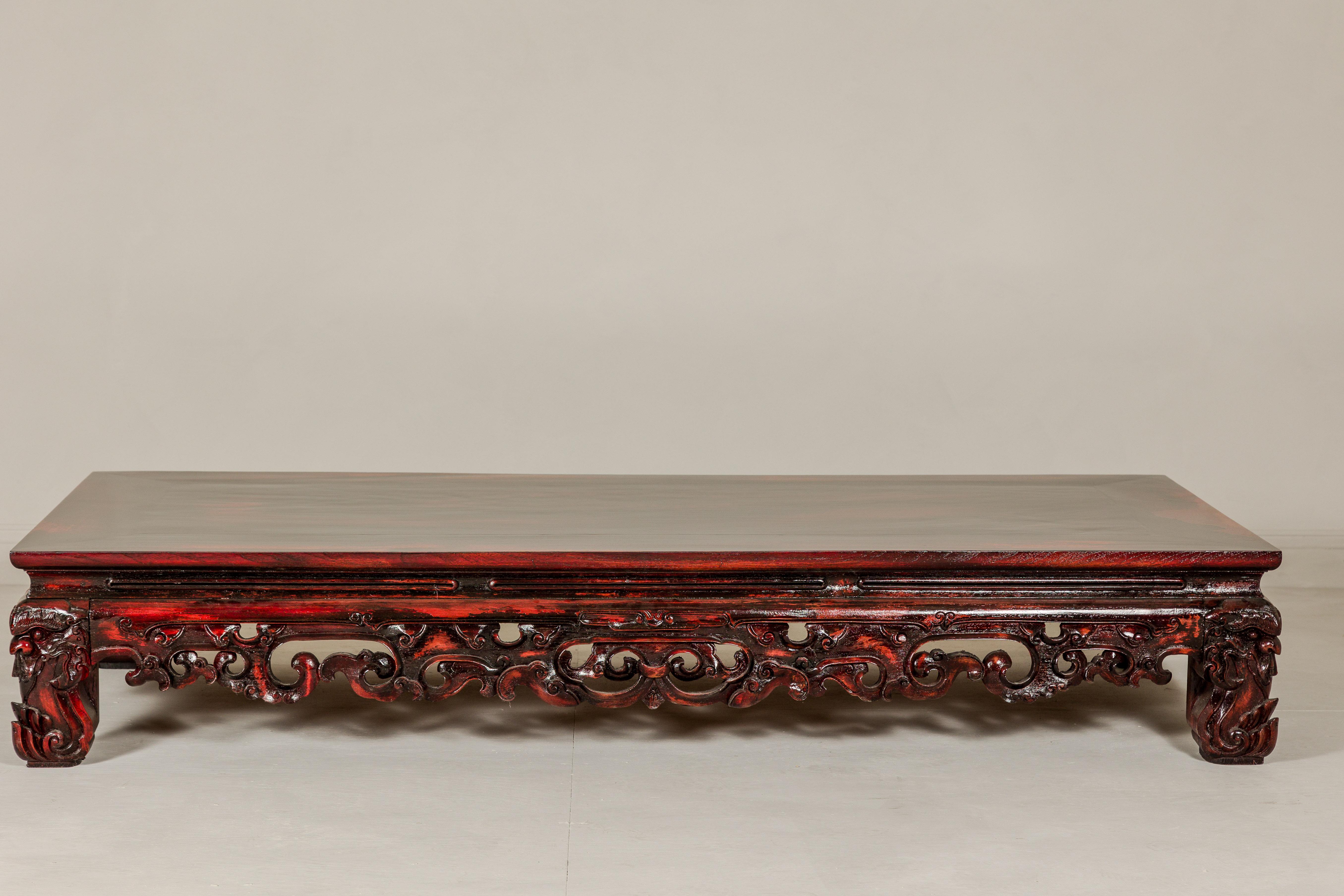 Qing Dynasty Low Kang Coffee Table with Reddish Brown Finish and Carved Décor For Sale 14