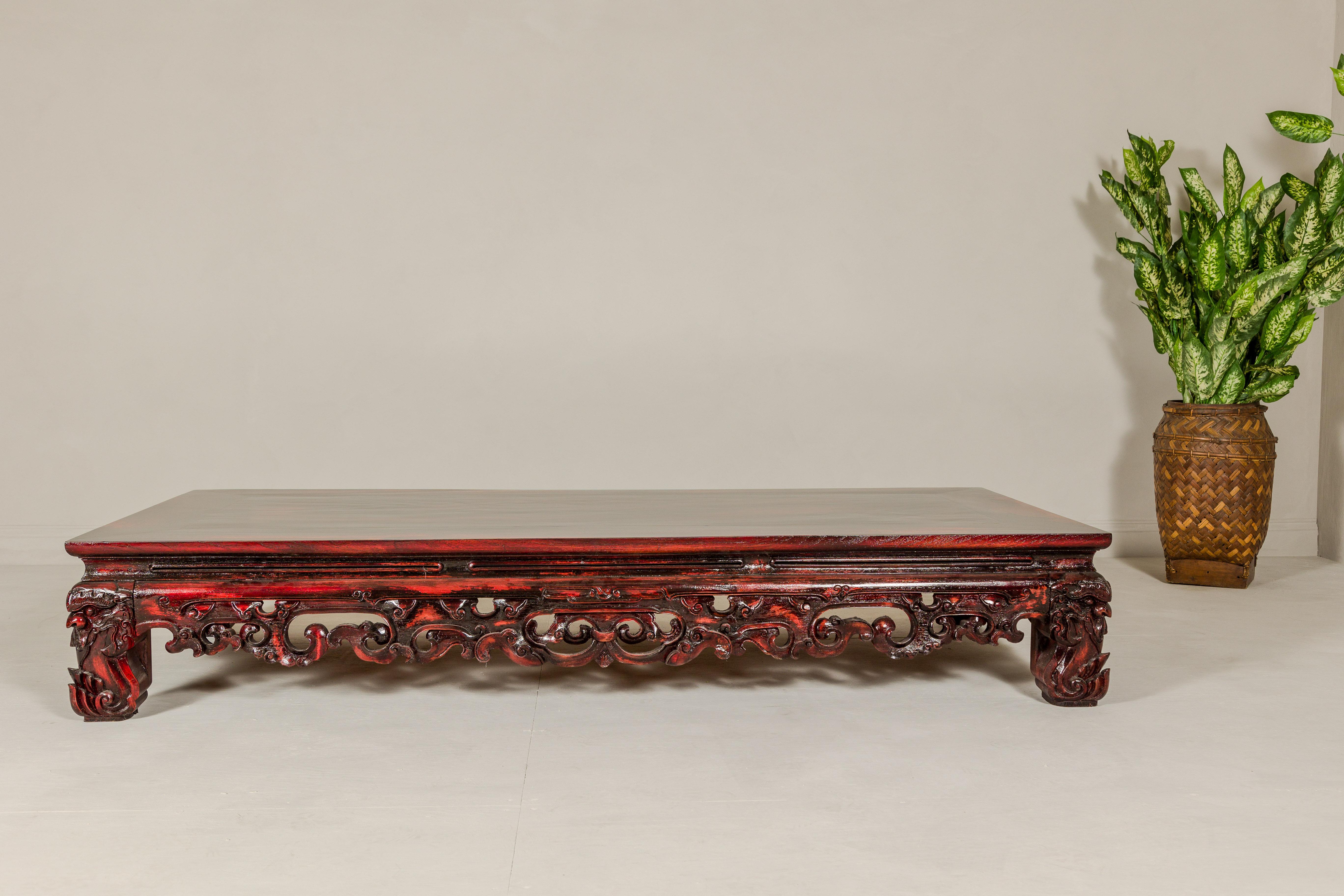 Chinese Qing Dynasty Low Kang Coffee Table with Reddish Brown Finish and Carved Décor For Sale