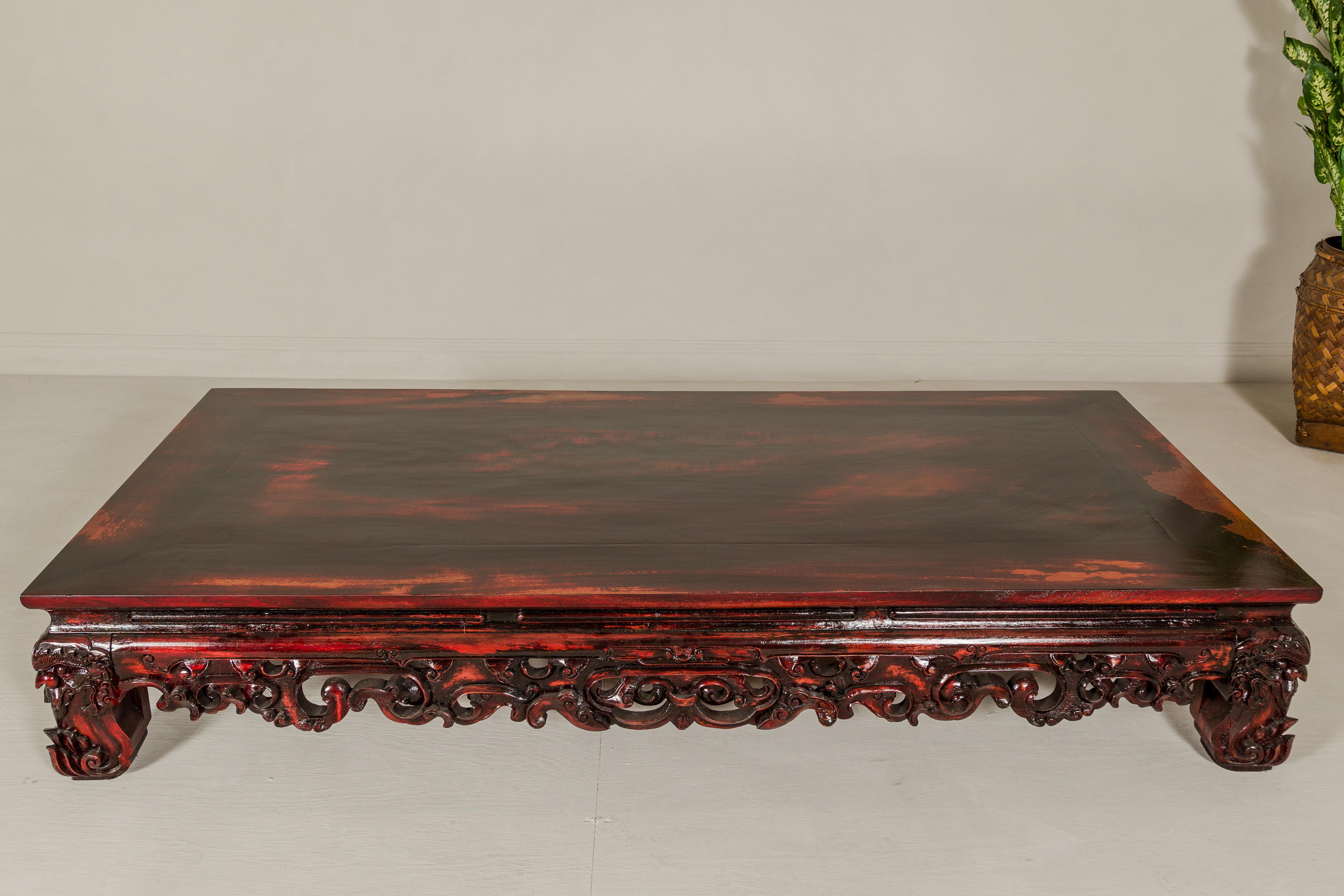Qing Dynasty Low Kang Coffee Table with Reddish Brown Finish and Carved Décor For Sale 1