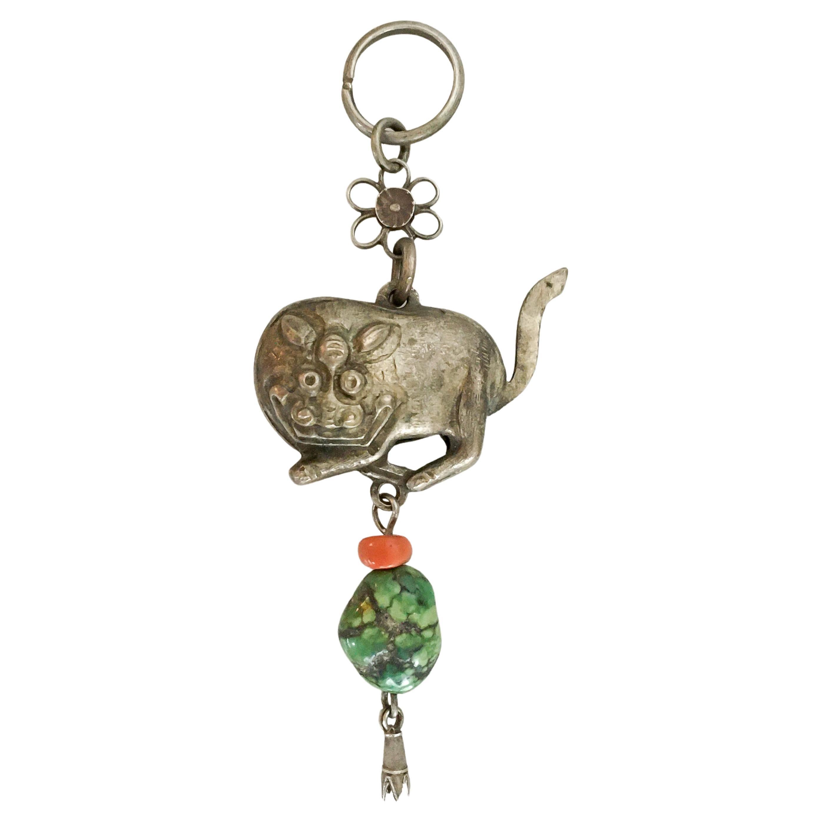This is an antique Qing dynasty hollow silver Ox amulet attached to a flower chain. The year 2021 is the year of the Ox. It is theorized that a person's characteristics are decided by their birth year's zodiac animal sign and zodiac element. So,