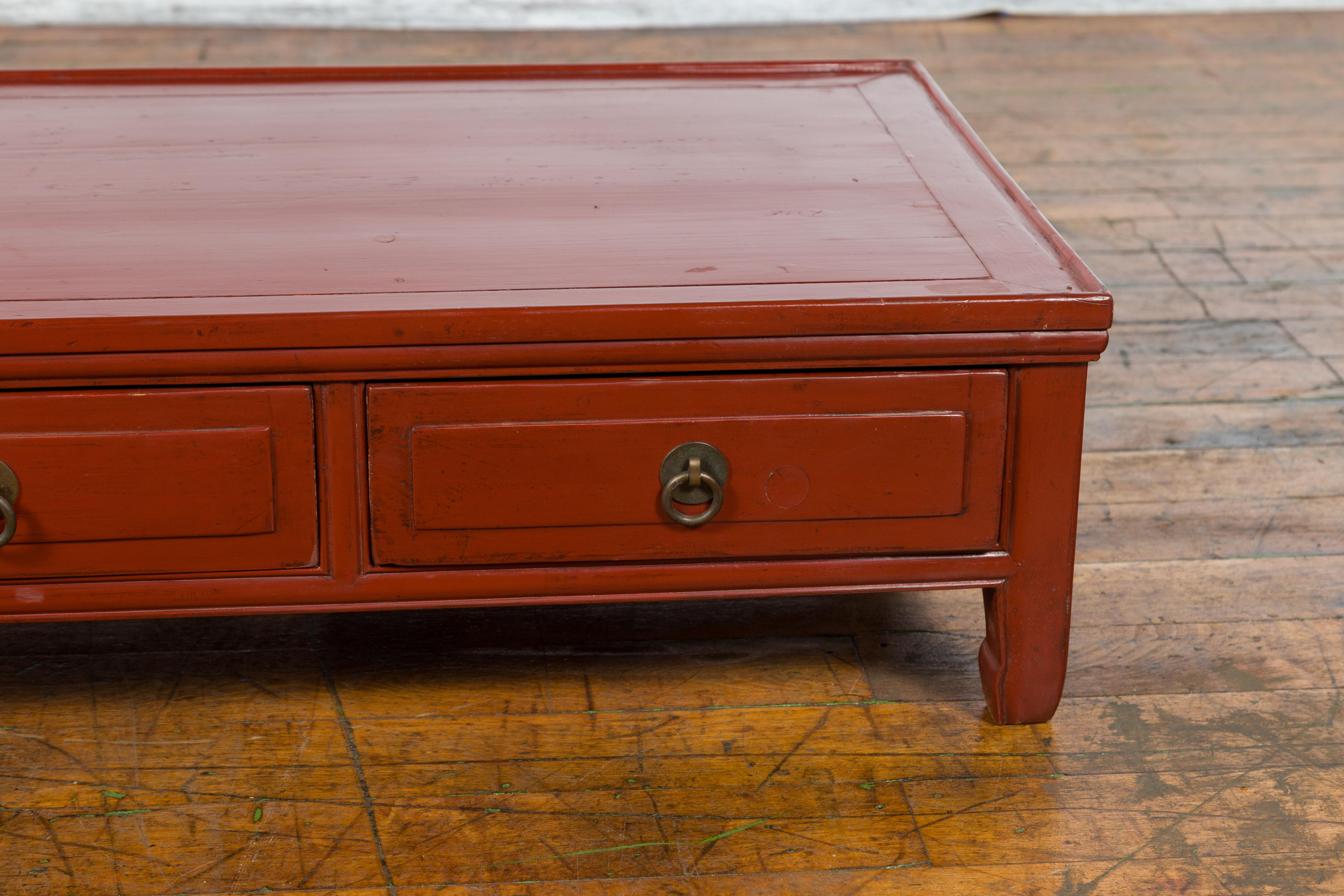 Qing Dynasty Red Lacquer Low Kang Coffee Table with Drawers and Horse Hoof Feet In Good Condition For Sale In Yonkers, NY