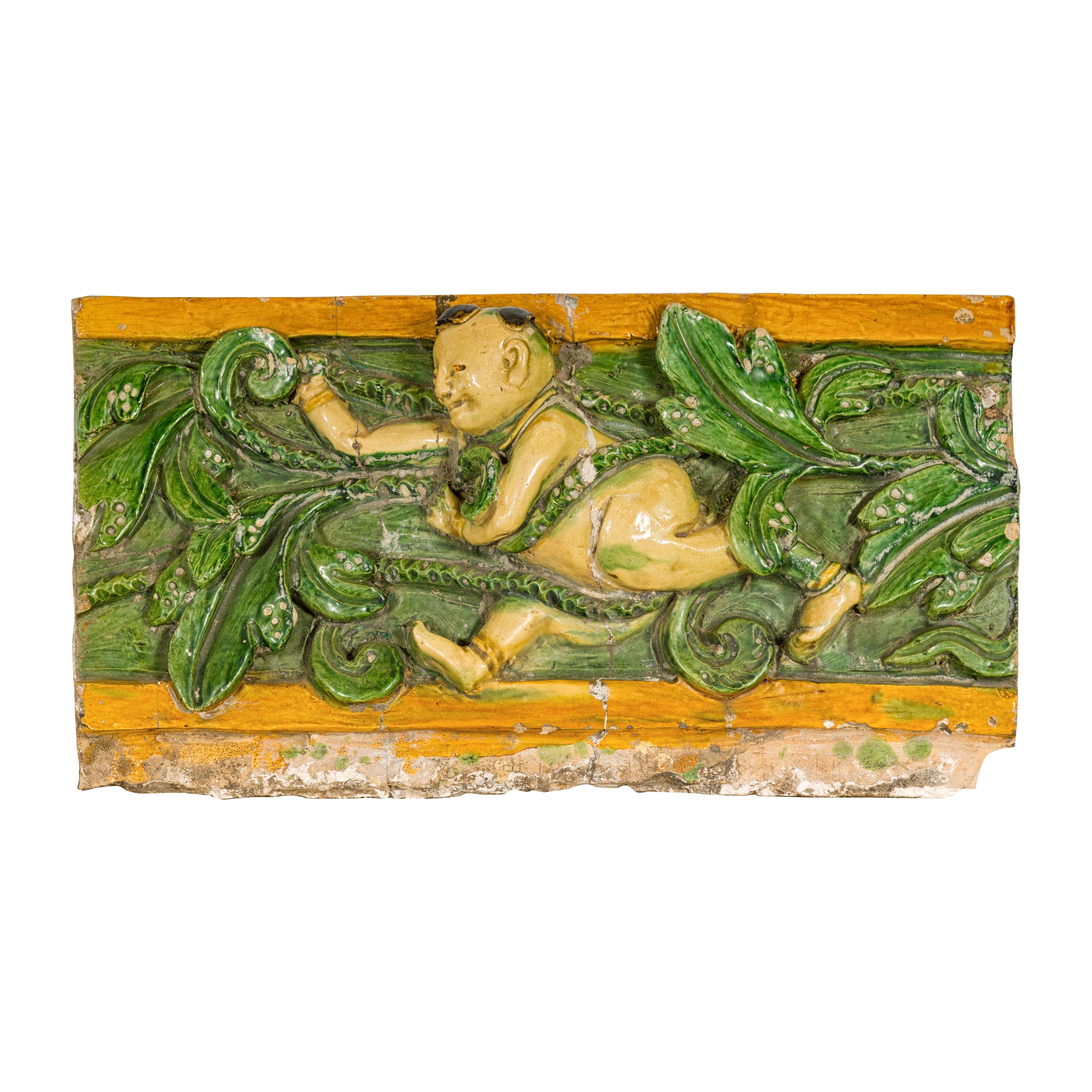 Qing Dynasty Tricolor Roof Fragment from a Temple Depicting a Boy Amidst Leaves For Sale 5