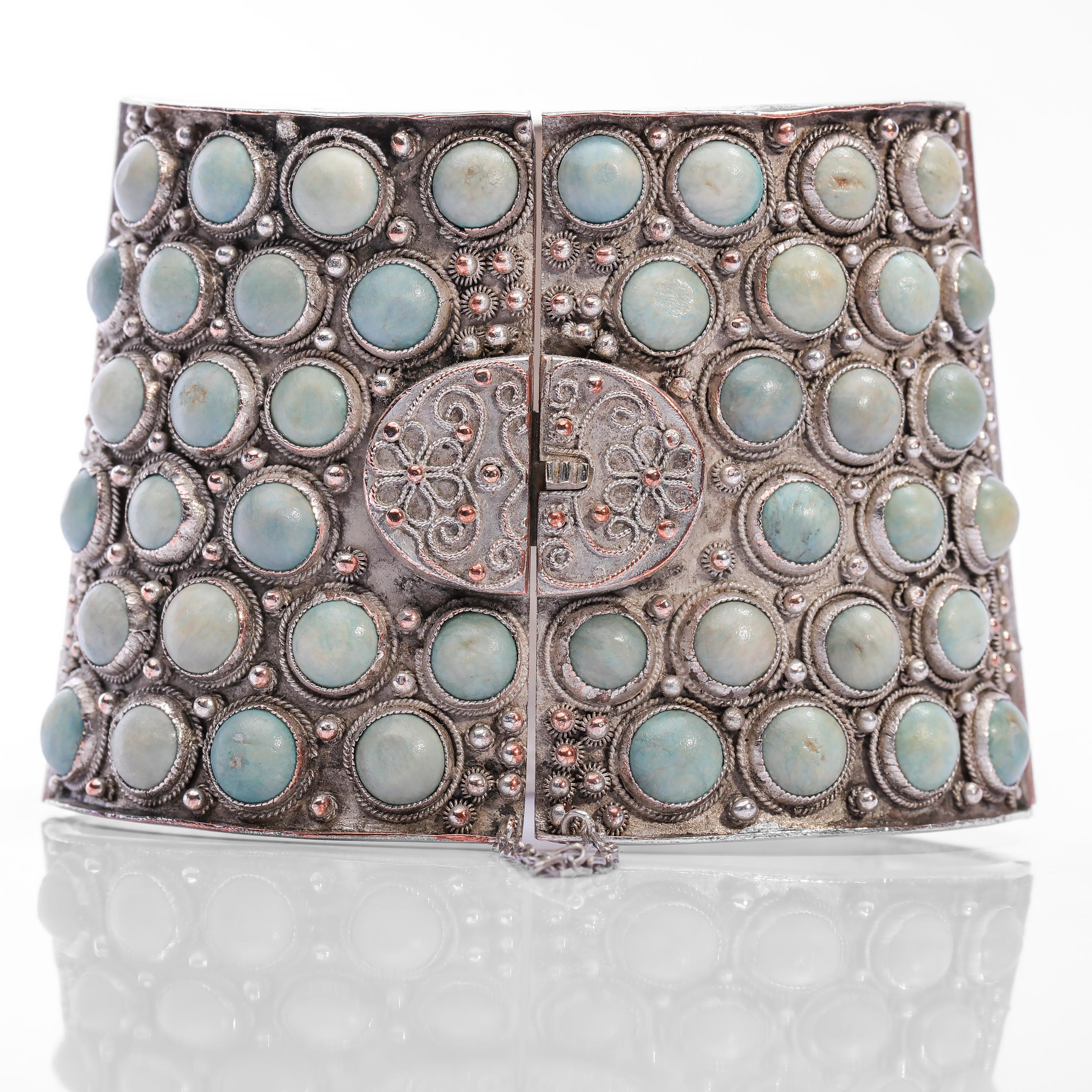 A stunning, original cuff bracelet from the Qing dynasty (China's final imperial dynasty, lasting from 1644 to 1912). Dating from approximately 1900, this unique cuff bracelet features 95 completely natural and untreated round turquoise cabochons