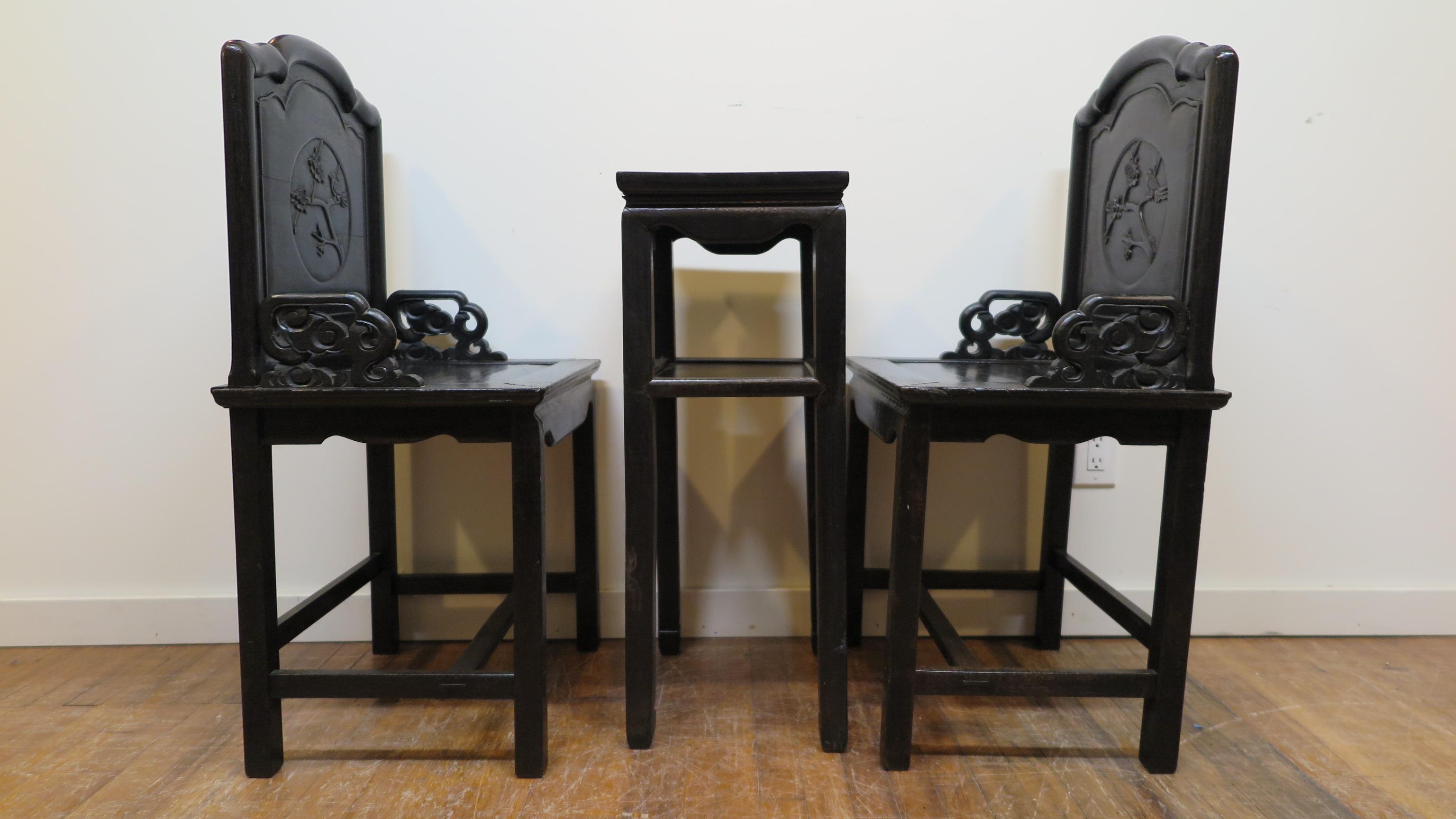 A late Qing dynasty Zitan wood chair set with table. Very nice table with two chairs made of rare Chinese hardwood, Zitan wood. The wood is very heavy and dense, sometimes referred to as Iron Wood. Color is blackish purple on finished sides. In good