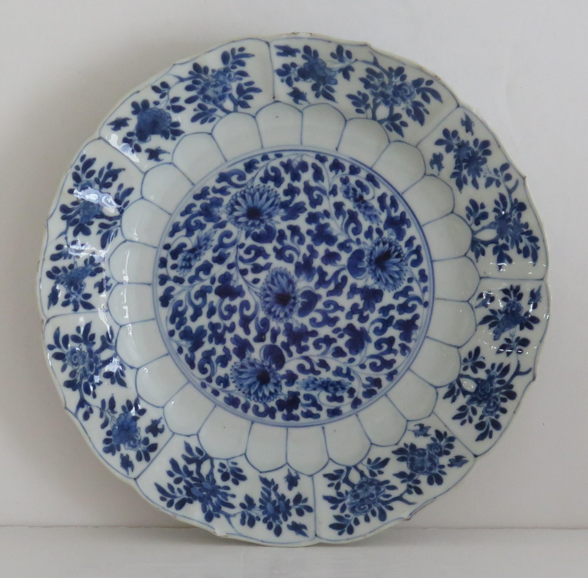 This is a very beautiful hand painted blue and white Chinese porcelain deep plate or dish, dating to the second half of the 17th century, circa 1675, Qing dynasty, the early part of reign of Kangxi ( 1662 to 1722) period.

The plate is very well