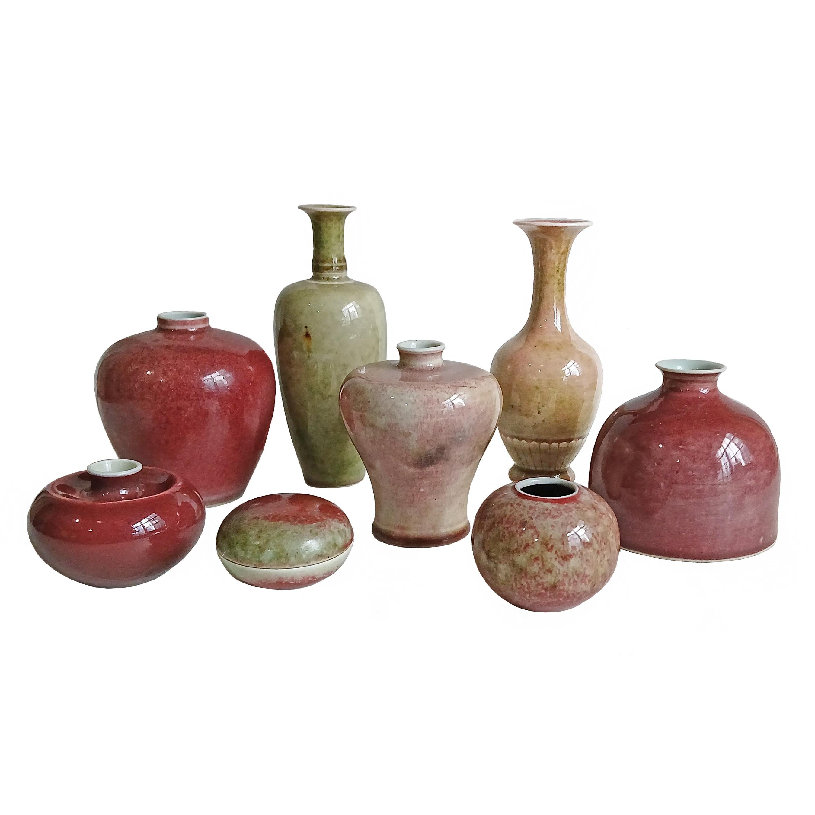A beautiful collection of 8 Qing peach-bloom glazed porcelain vases. 
China, late 19th Century. 

All of the vases, except one, have the six-character mark of the 15-16th Century Kangxi reign, although they were made at a later date, probably during