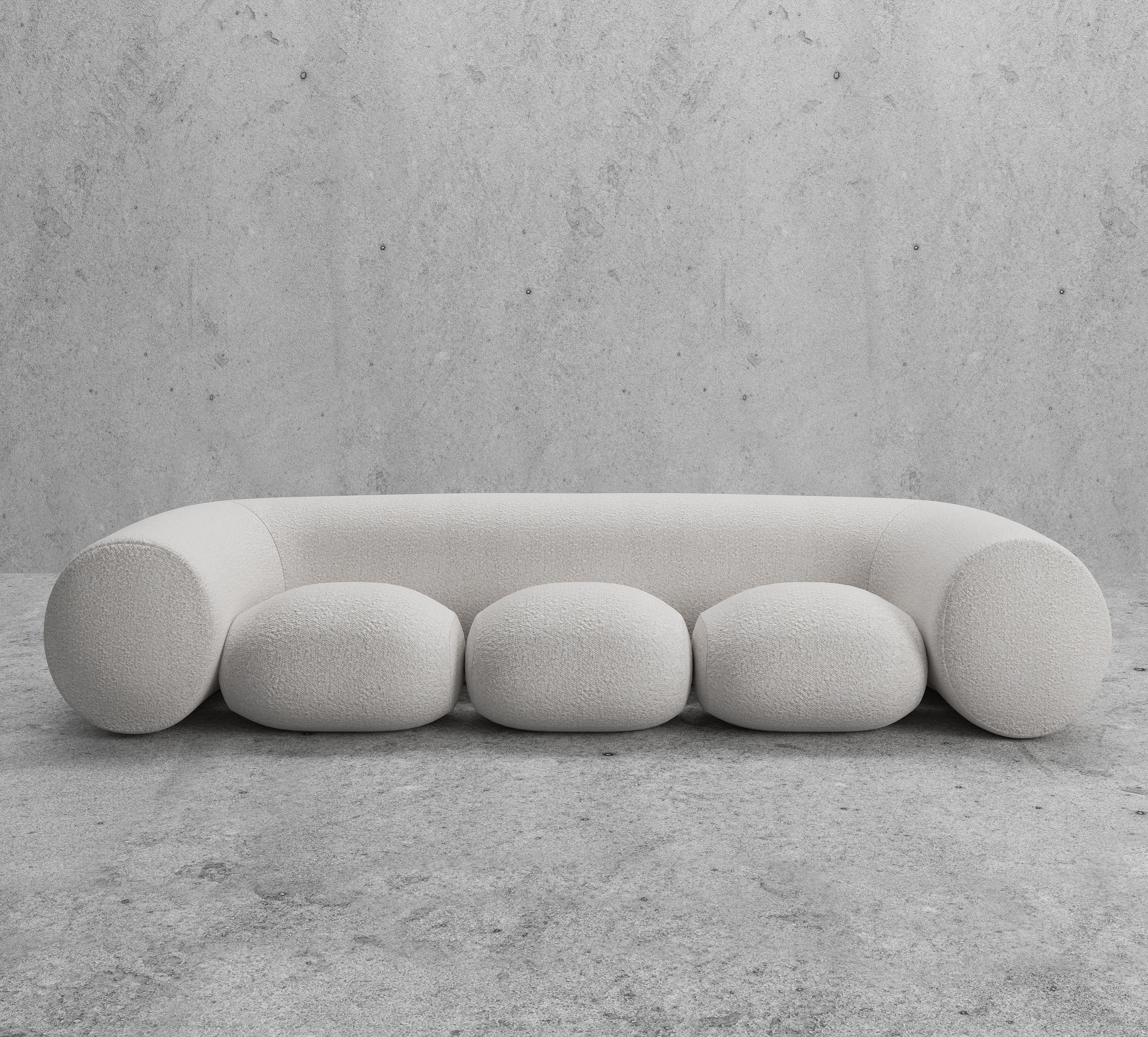 The Pammy sofa from the Bubbly collection by Koki Design House is like sitting on a cloud. Not a simple sofa but a new take on a relaxing experience in style adding playfulness to your space. Upholstery in bouclé fabric. 

The internal structure of