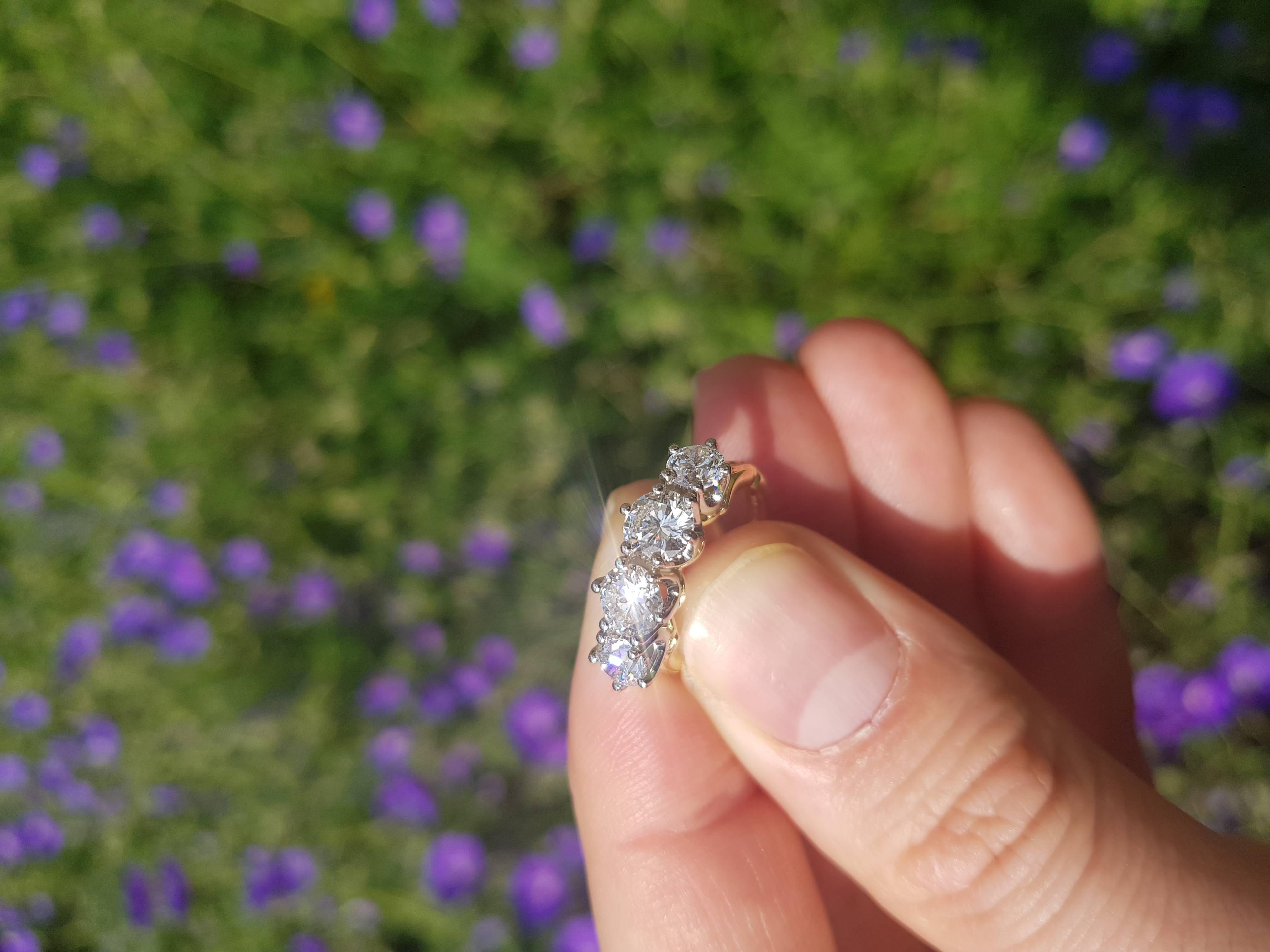 With a unique Victorian style influence, this contemporary, bespoke engagement ring contains 4 round cut, G-colour, GIA certified diamonds, set in 18 carat yellow gold.