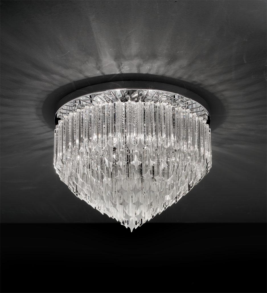 talian flush mount or chandelier with clear Murano glasses cut in Quadriedri technique arranged in layers on chrome finish metal frame by Fabio Ltd / Inspired by Venini / Made in Italy
6 lights / E12 or E14 type / max 40W each
Diameter: 20 inches /