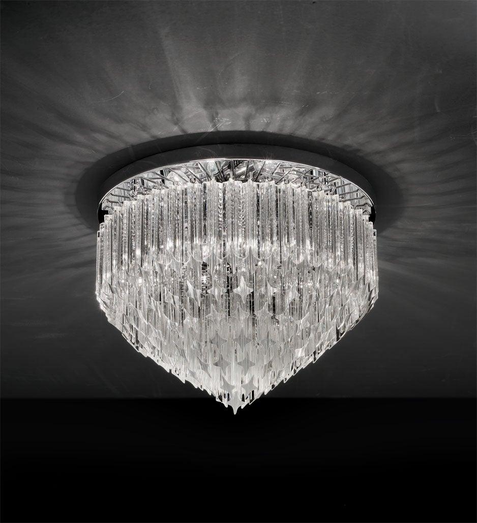 Italian flushmount or chandelier with clear Murano glasses cut in Quadriedri technique arranged in layers on chrome finish metal frame by Fabio Ltd / Inspired by Venini / Made in Italy
6 lights / E12 or E14 type / max 40W each
Measures: Diameter 20