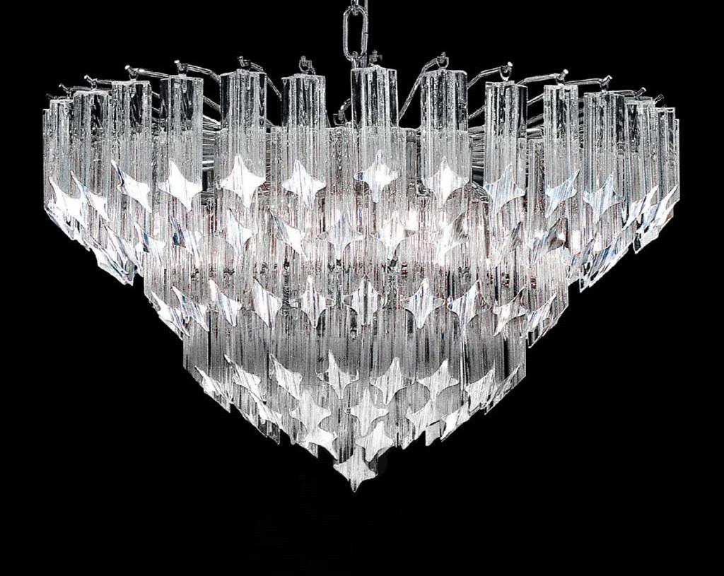 Italian chandelier with clear Murano glasses cut in Quadriedri technique mounted on chrome finish metal frame / Made in Italy
6 lights / E12 or E14 type / max 40W each
Diameter: 23.5 inches / Height: 12 inches plus chain and canopy
Order Reference