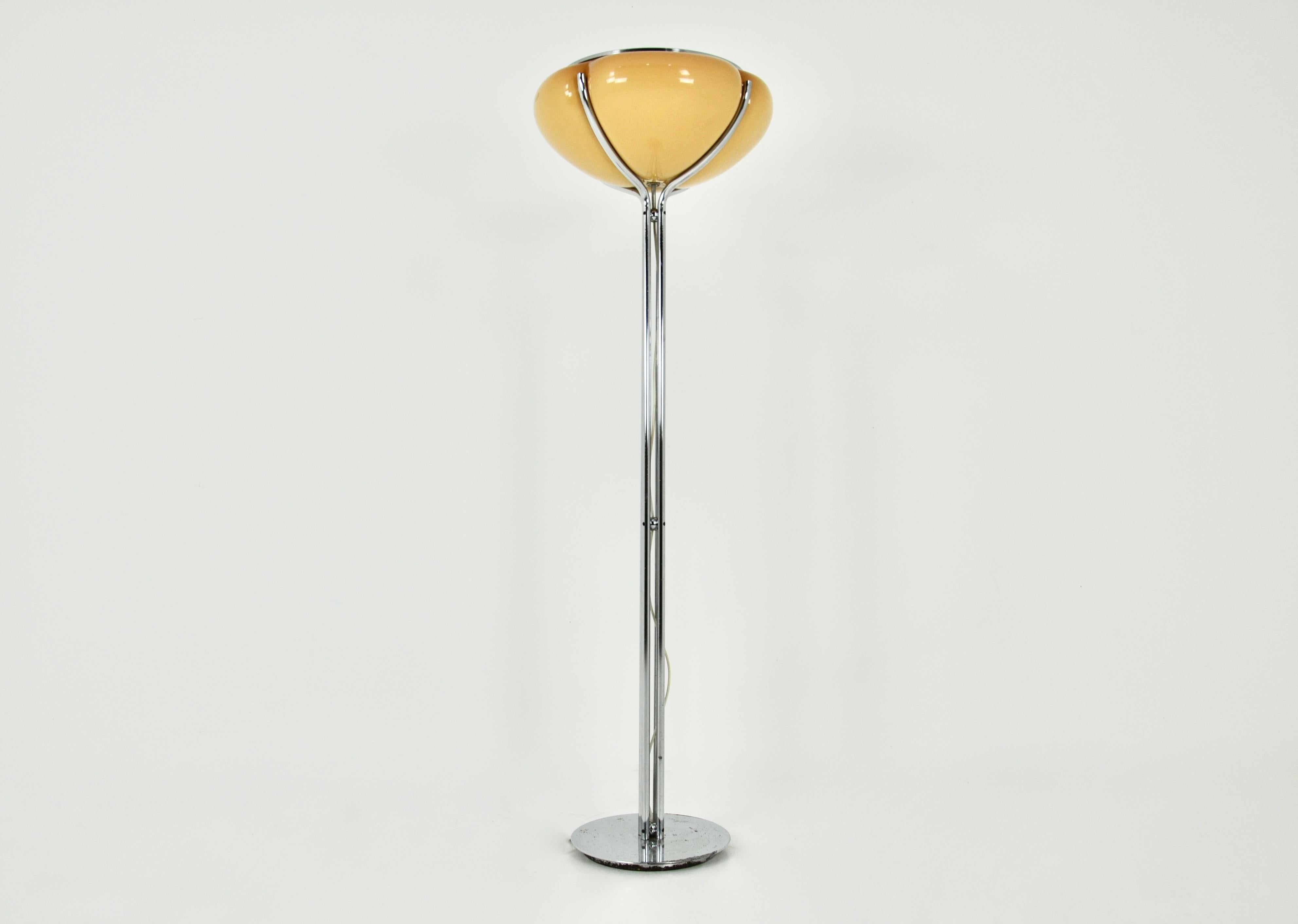 Floor lamp in plastic and metal, orange and chrome, designed by Gae Aulenti for Harvey Guzzini. Stamped Harvey Guzzini. Wear due to time and age of the lamp.