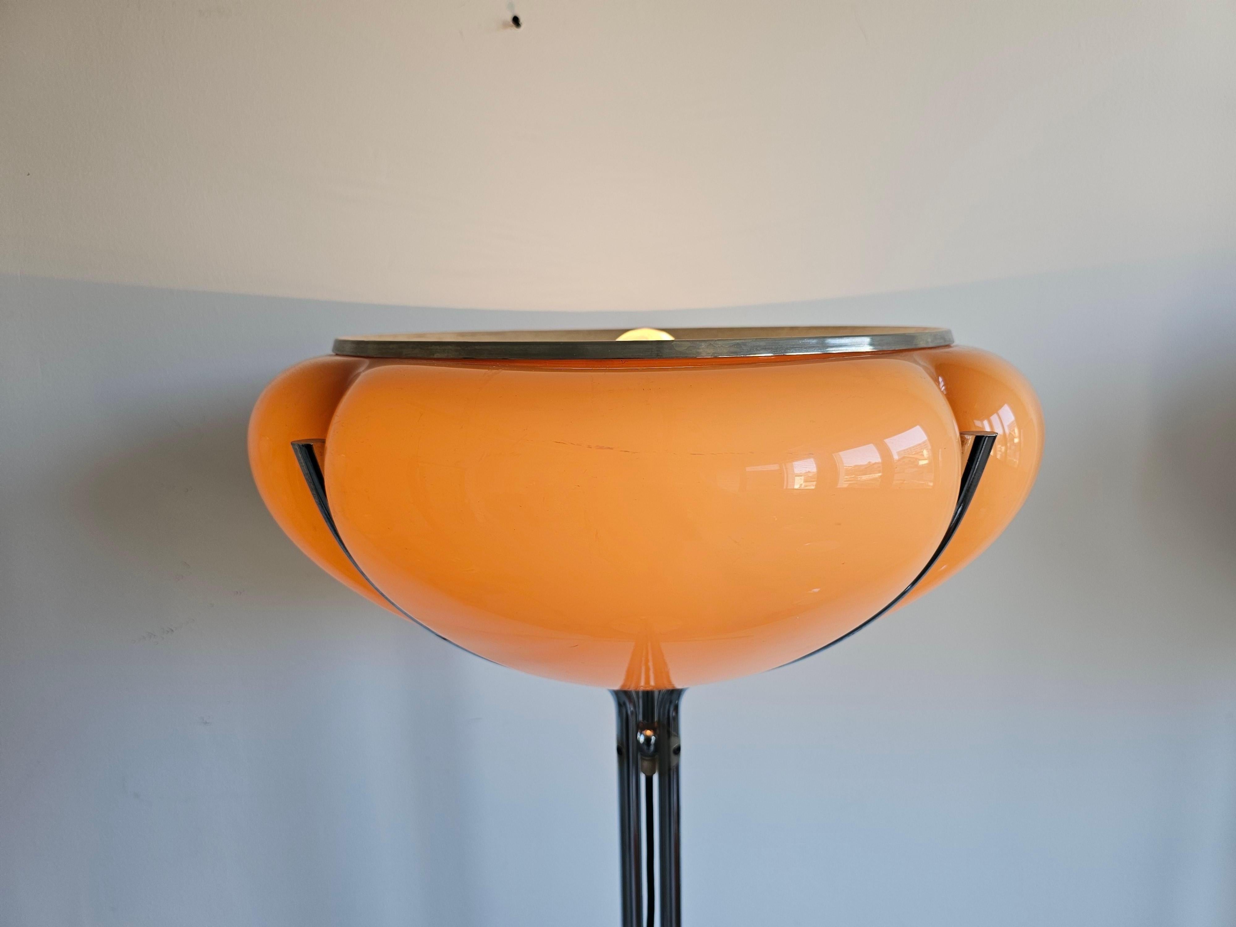 In this listing you will find an exceptionally rare floor lamp designed by Harvey Guzzini. The model is called Quadrifoglio, due to its 4-arm stand, which holds a beautifully designed acrylic shade in color of cappuccino. The lamp was designed by a