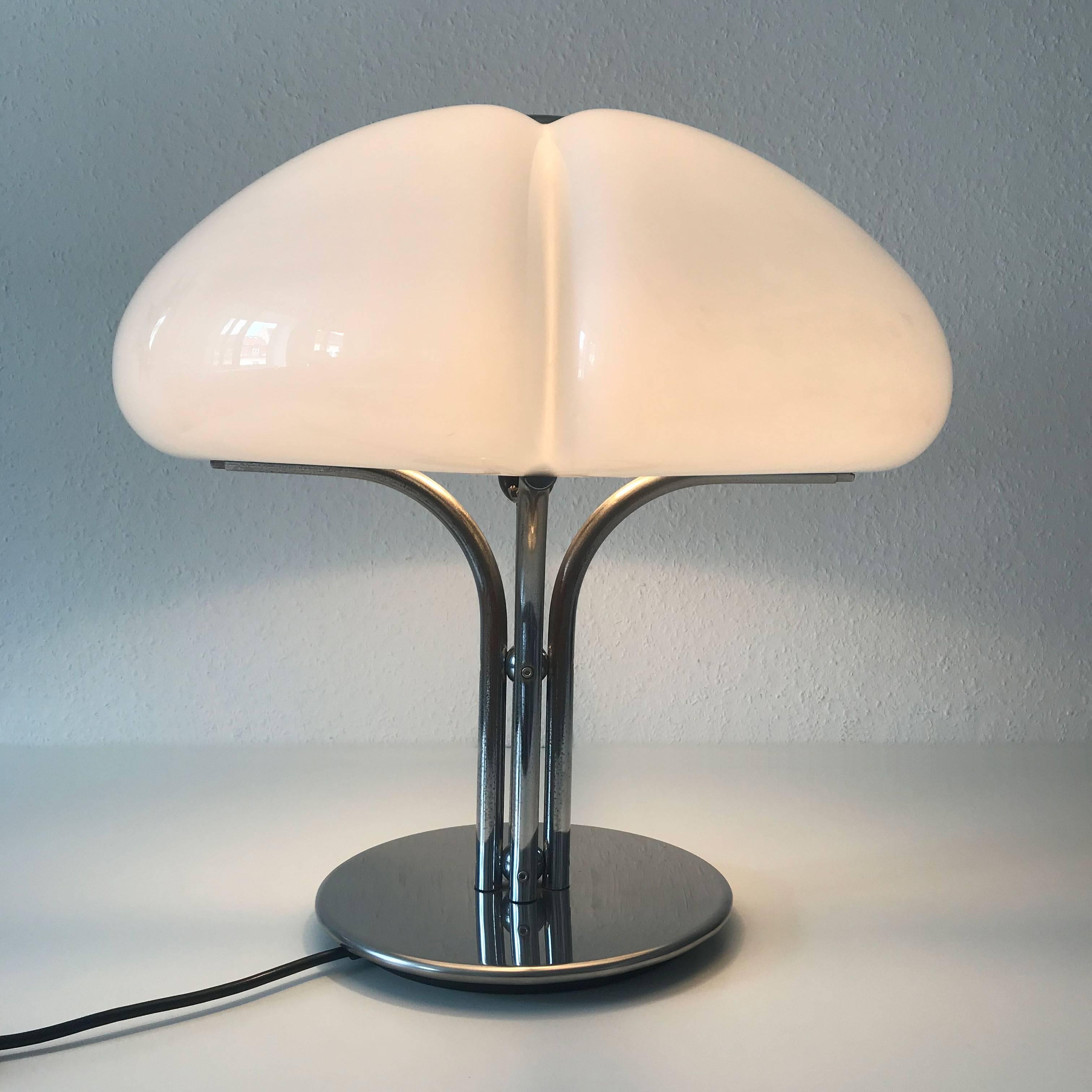 Amazing, rare and large Mid-Century Modern table lamp. Designed by Gae Aulenti in 1968. Manufactured by Harvey Luce or Harvey Guzzini in 1960s-1970s, Italy.

This most sought, elegant table lamp is executed with chrome-plated steel and