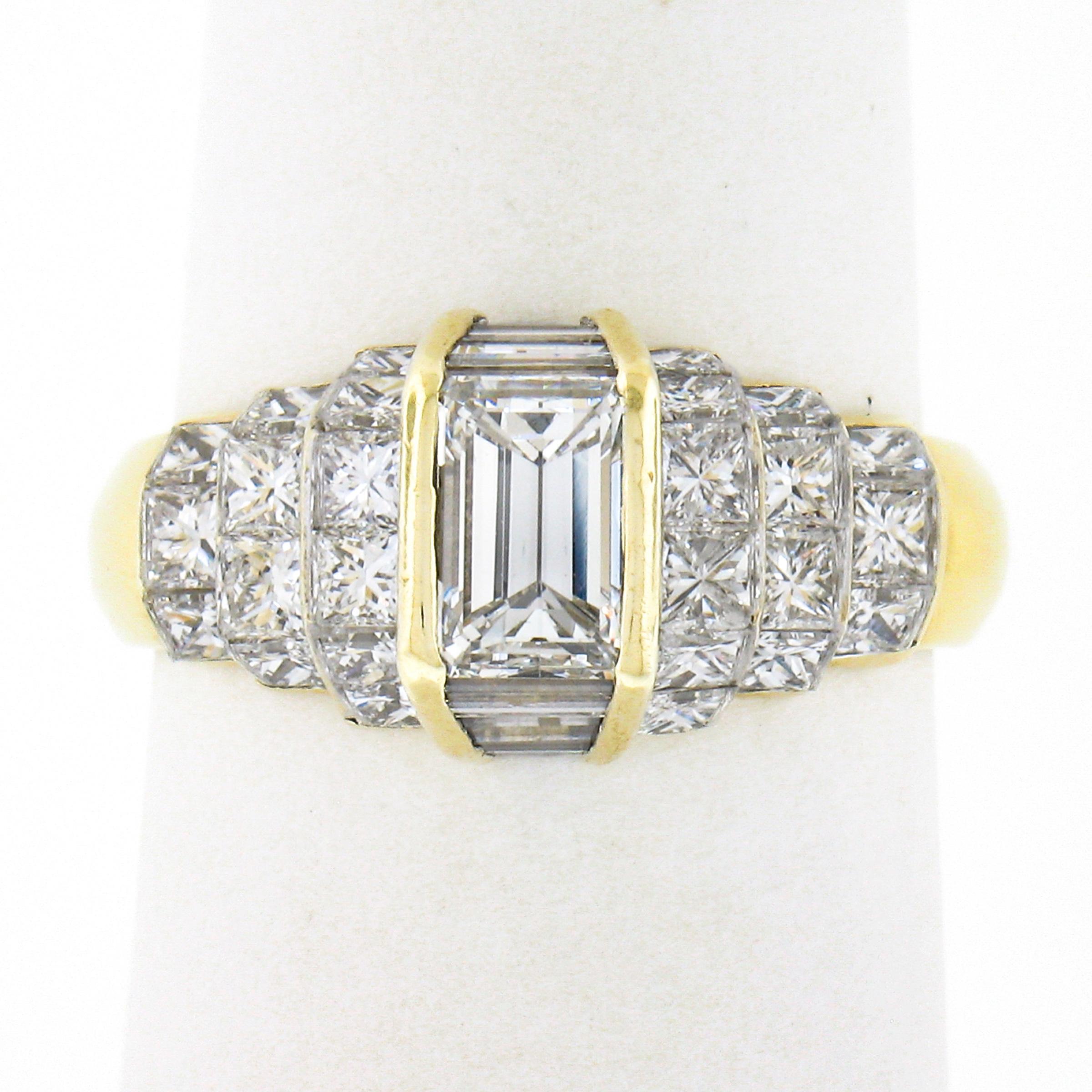 This stunning and uniquely designed diamond ring is designed by Quadrillion and crafted in solid 18k yellow gold. It features a VERY FINE quality emerald cut diamond solitaire that is neatly channel set at the top of the rings' elegant pyramid style