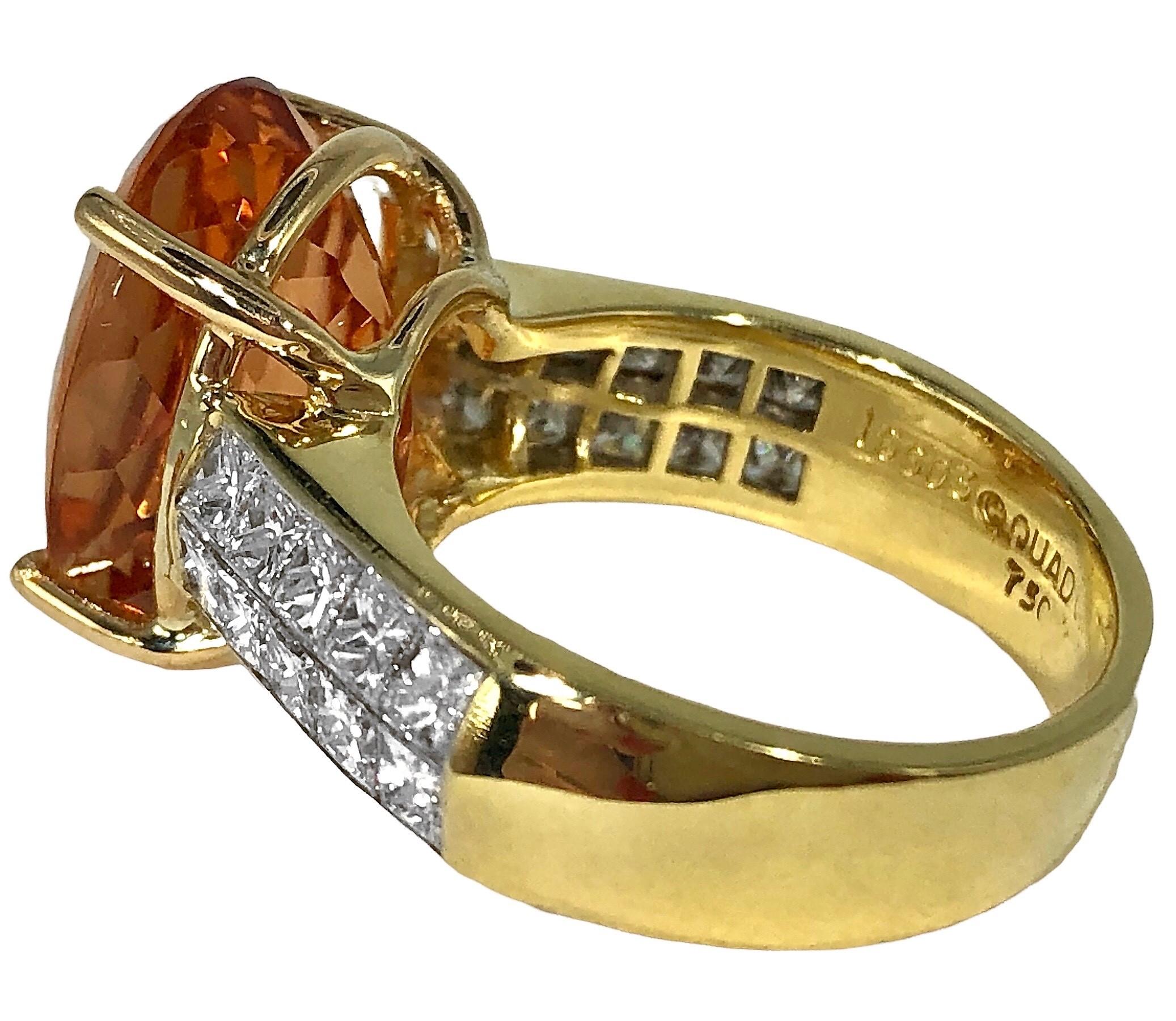 This 18k yellow gold fashion ring is a late 20th century industry icon, signed Quadrillion brand.  Set with one 10.82ct oval Imperial Topaz* flanked by twenty quadrillion cut diamonds on the ring's shoulders. The vivid golden-orange color of the