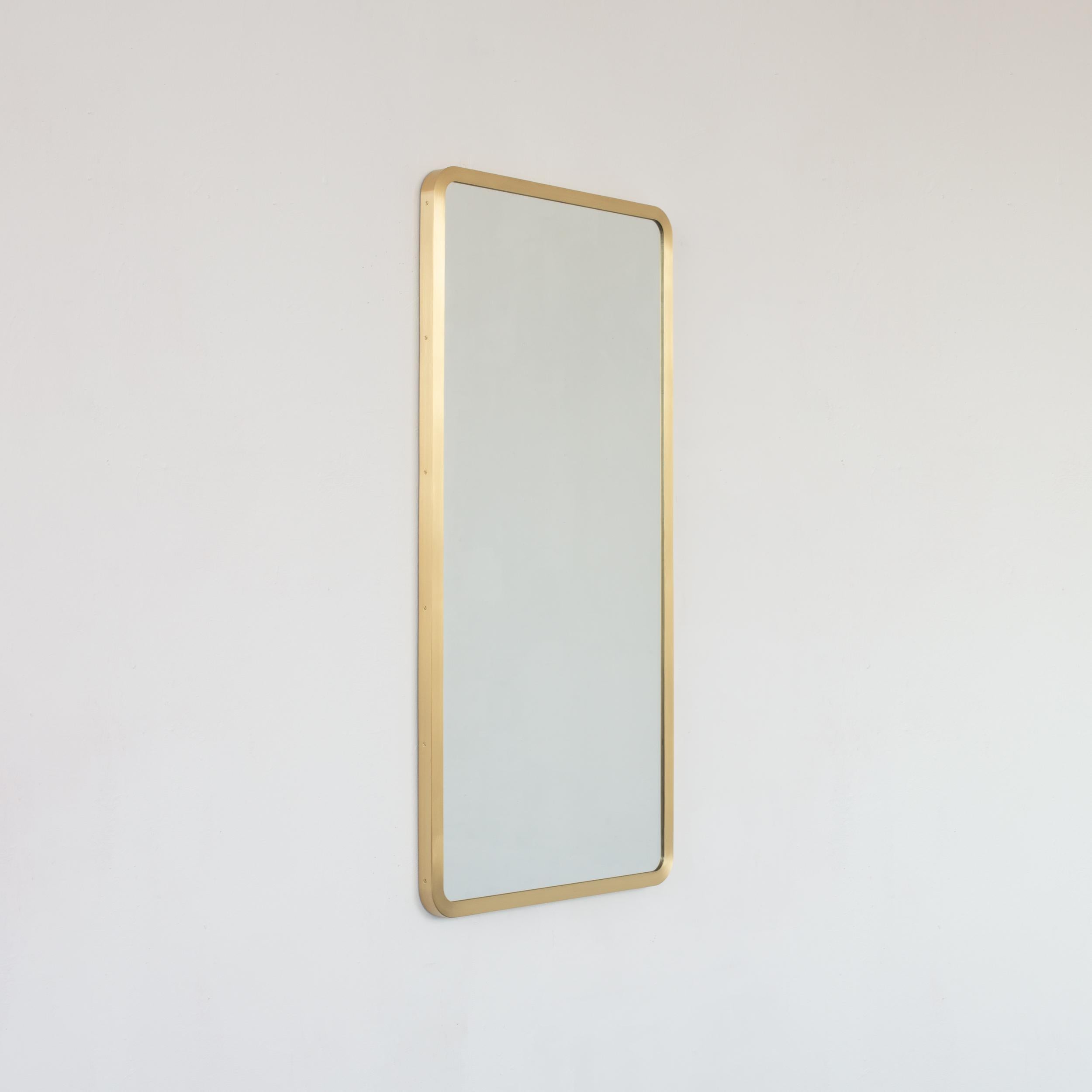 Modern rectangular mirror with an elegant solid brushed brass frame. Part of the charming Quadris collection, designed and handcrafted in London, UK. 

Supplied fitted with a specialist z-bar for an easy installation. A split batten hanging system