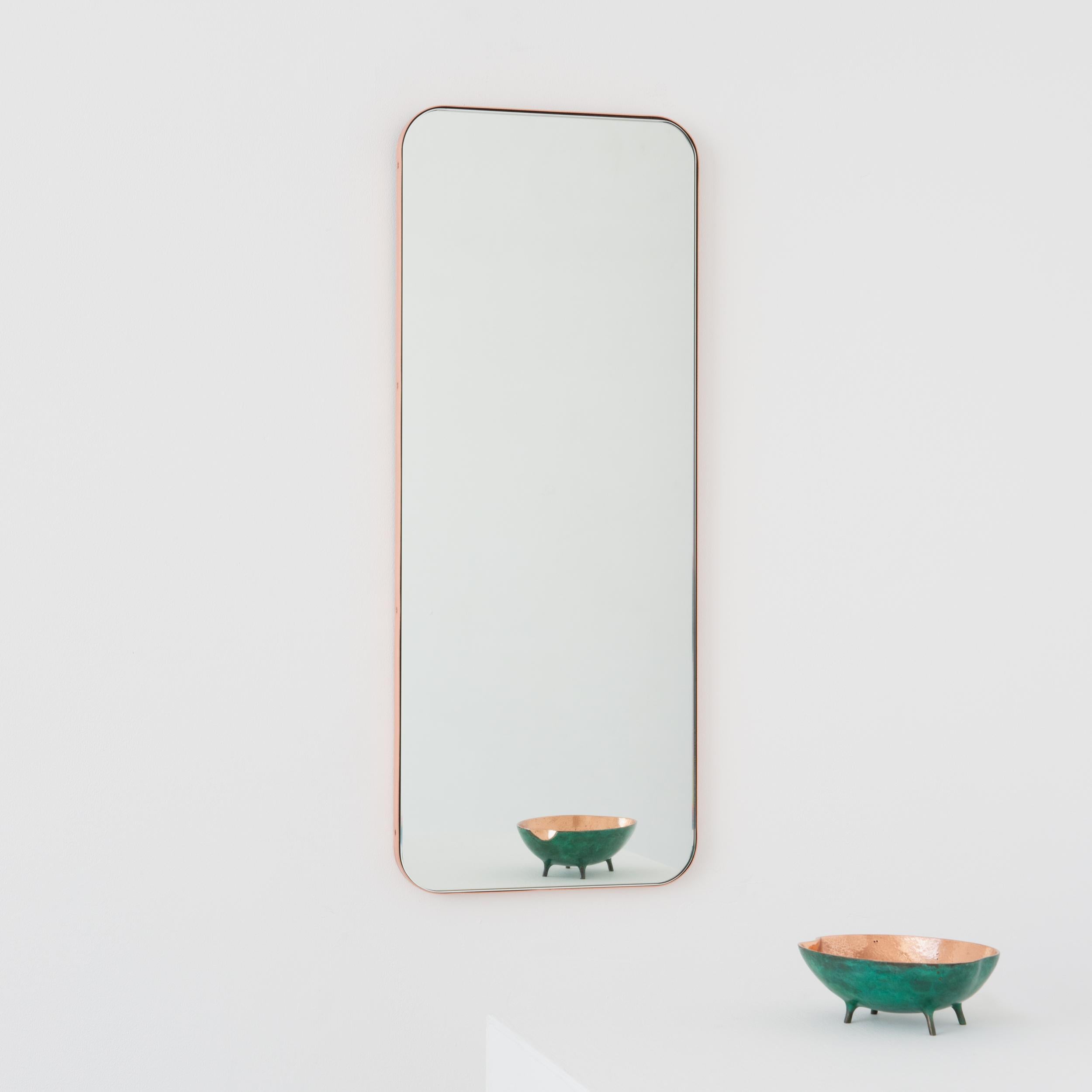 Modern rectangular mirror with an elegant solid brushed copper frame. Part of the charming Quadris collection, designed and handcrafted in London, UK. 

Supplied fitted with a specialist z-bar for an easy installation. A split batten hanging system