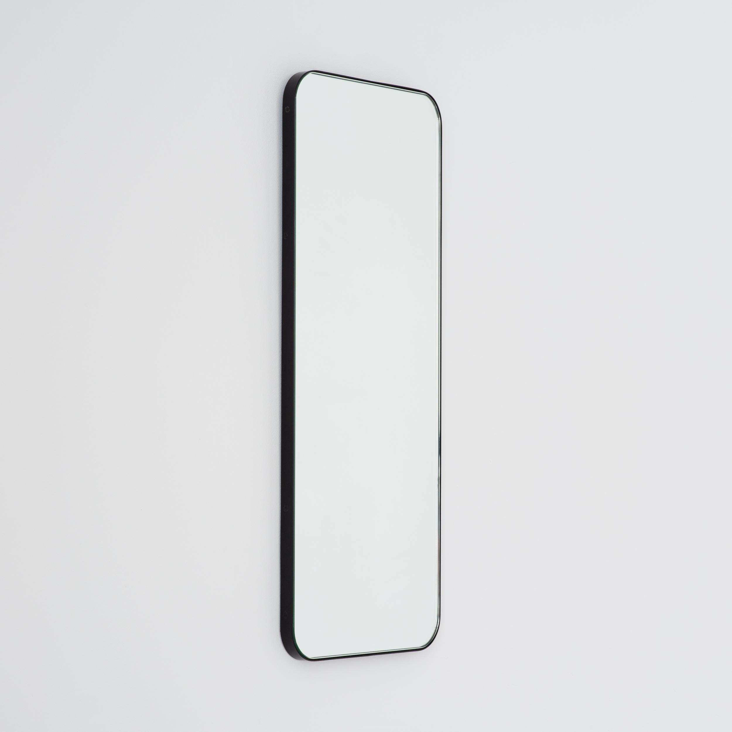 Modern rectangular mirror with an elegant black. Part of the charming Quadris collection, designed and handcrafted in London, UK. 

Our mirrors are designed with an integrated French cleat (split batten) system that ensures the mirror is securely